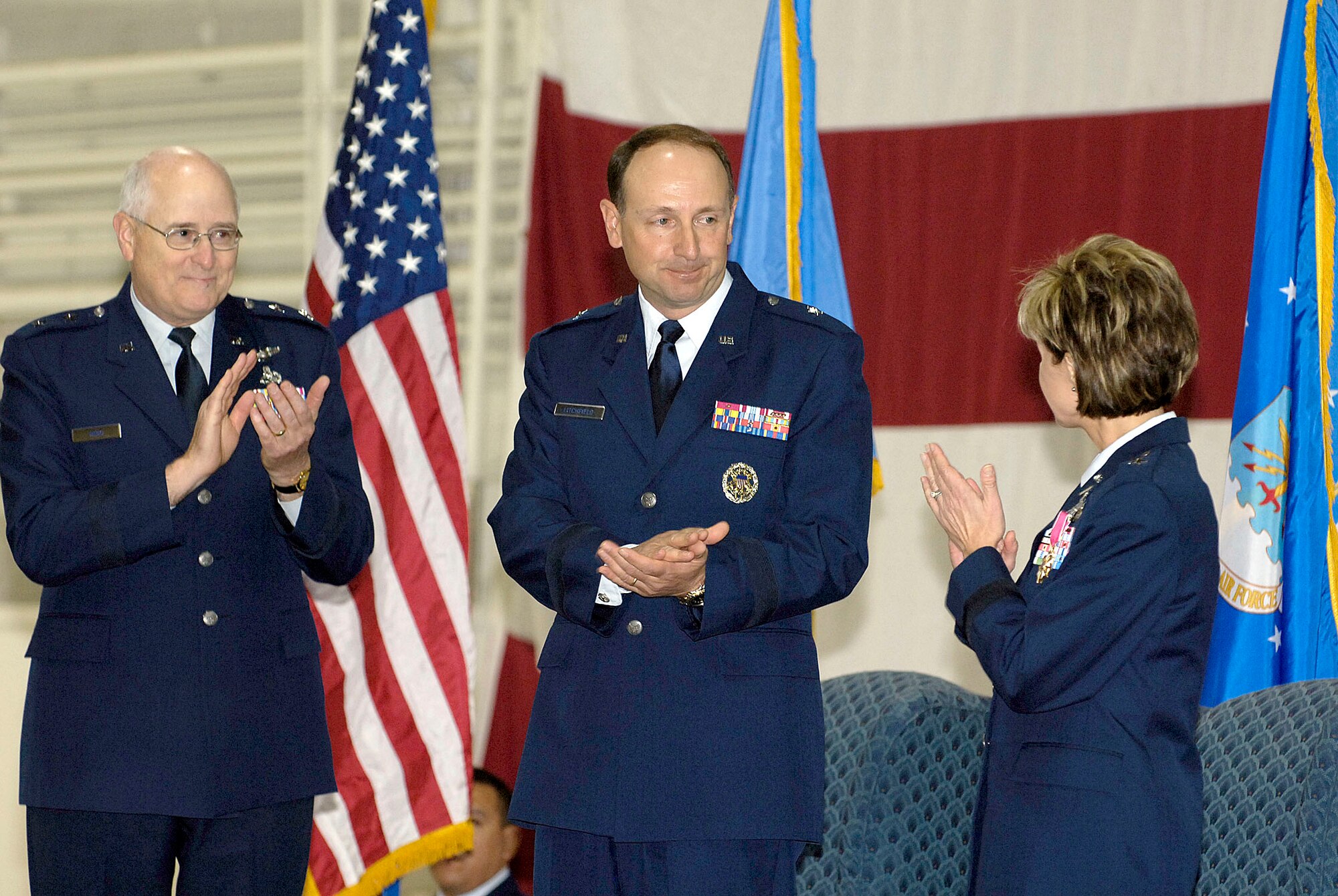 Brig. Gen. Bruce Litchfield, center, accepted command of the 76th Maintenance Wing from Brig. Gen. Judith Fedder, in a ceremony Jan. 6 presided over by Maj. Gen Loren Reno, former Oklahoma City Air Logistics Center commander. (Air Force photo/Margo Wright)