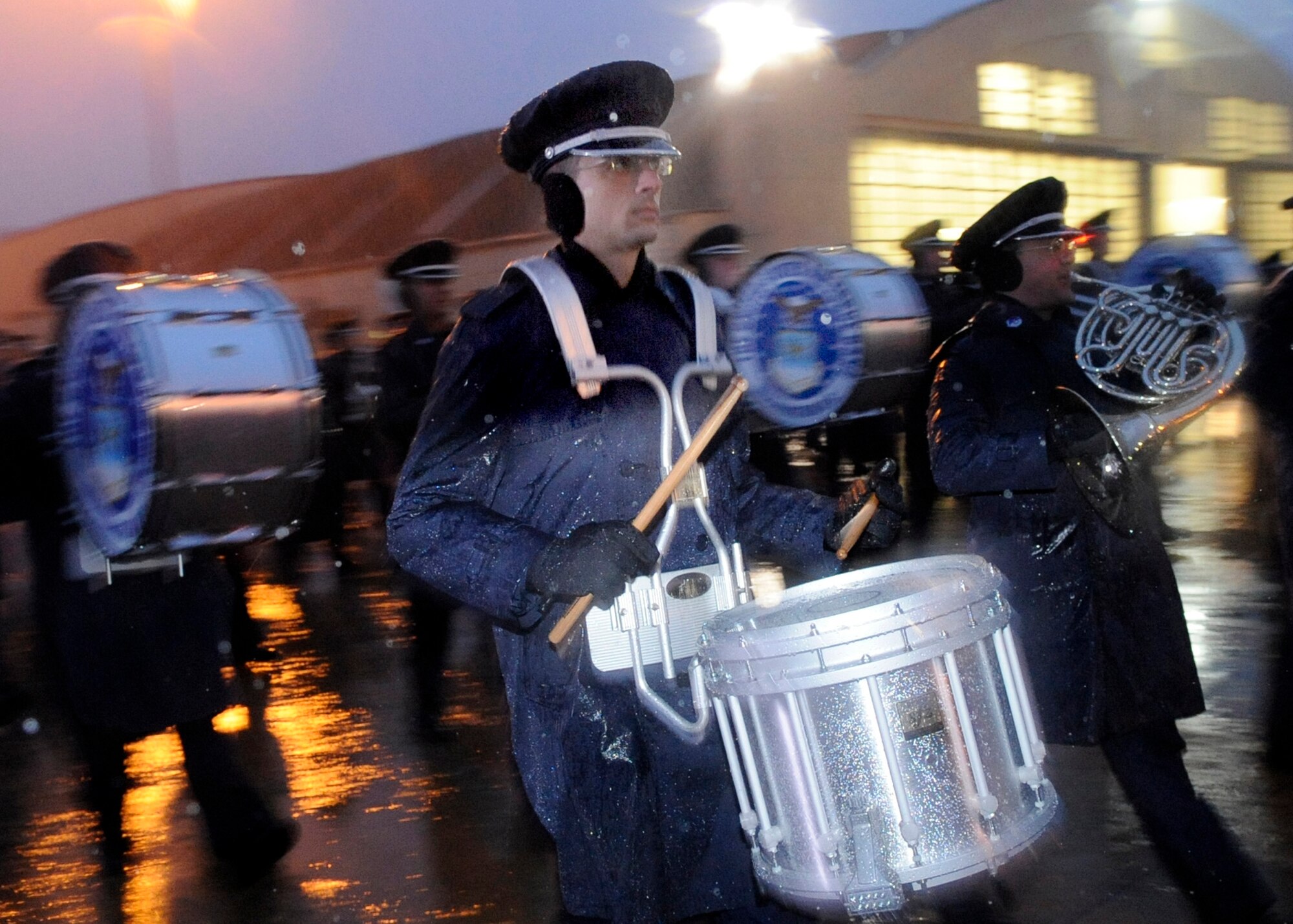 The 99-member Air Force Band practices songs while marching in the morning rain Jan. 7 at Andrews Air Force Base, Md., in preparation for the inauguration of President-elect Barak Obama. (U.S. Air Force photo/Master Sgt. Cecilio M. Ricardo) 