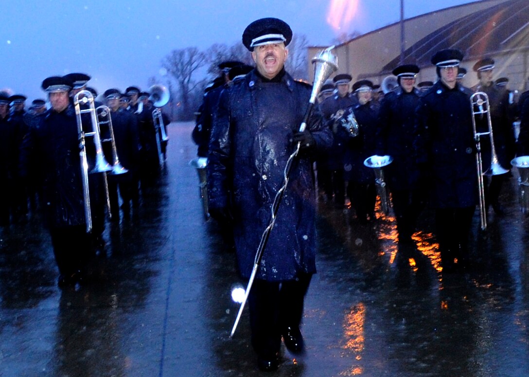 Drum major, Chief Master Sergeant Edward Teleky leads a 99 piece Air Force band in the January morning rain while preparing his team to perform during the Inauguration of President-elect Barak Obama.  The practice took place on the Andrews Air Force Base, flightline Jan. 7, 2009.  It will be his 6th inauguration. (US Air Force photo/Master Sgt. Cecilio M. Ricardo)