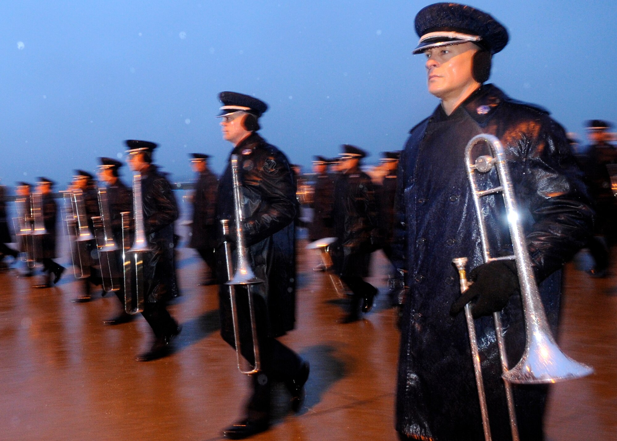 Master Sergeant Ryan Haines marches  in the January morning rain with the 99 piece Air Force band in preparation for the Inauguration of President-elect Barak Obama.  They are preparing for real-world weather scenarios.  The practice took place on the Andrews Air Force Base flightline, Jan. 7, 2009.  (US Air Force photo/Master Sgt. Cecilio M. Ricardo) 