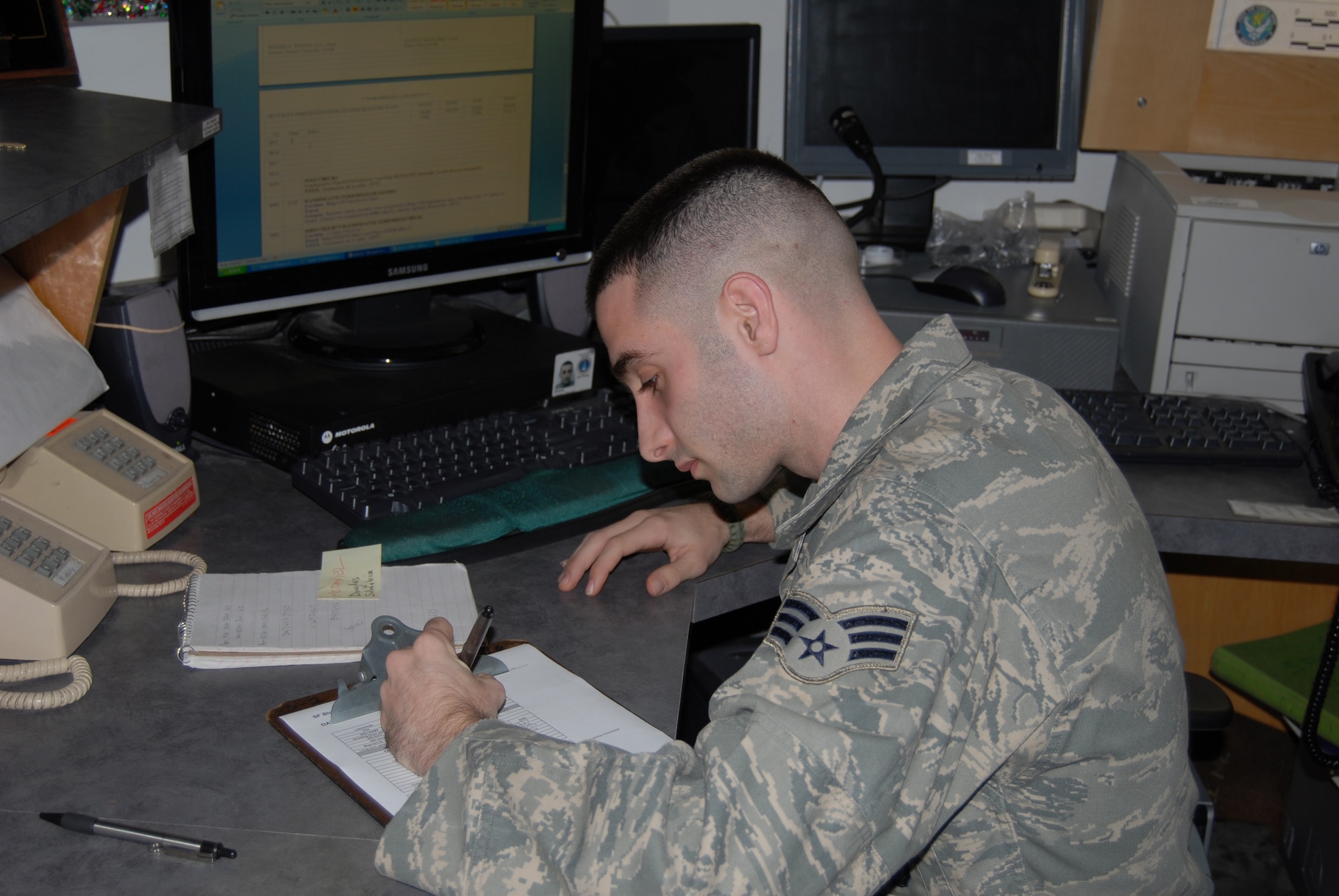 Senior Airman Jeremy Woods, 43rd Security Forces Squadron, works the law enforcement desk Dec. 31 and worked from 4:30 p.m. New Year’s Eve to 4:30 a.m. New Year’s Day. Airman Woods was off on Christmas and was able to spend time with friends and family. He said that all 43rd SFS members were working a six day on and six day off schedule.
According to Airman Woods there were 15 people working the New Year’s Eve evening shift (some worked different hours) for the 43rd SFS and all volunteered to work  so they could get the Christmas holiday off.
(U.S. Air Force Photo by Tech Sgt. Todd Wivell)