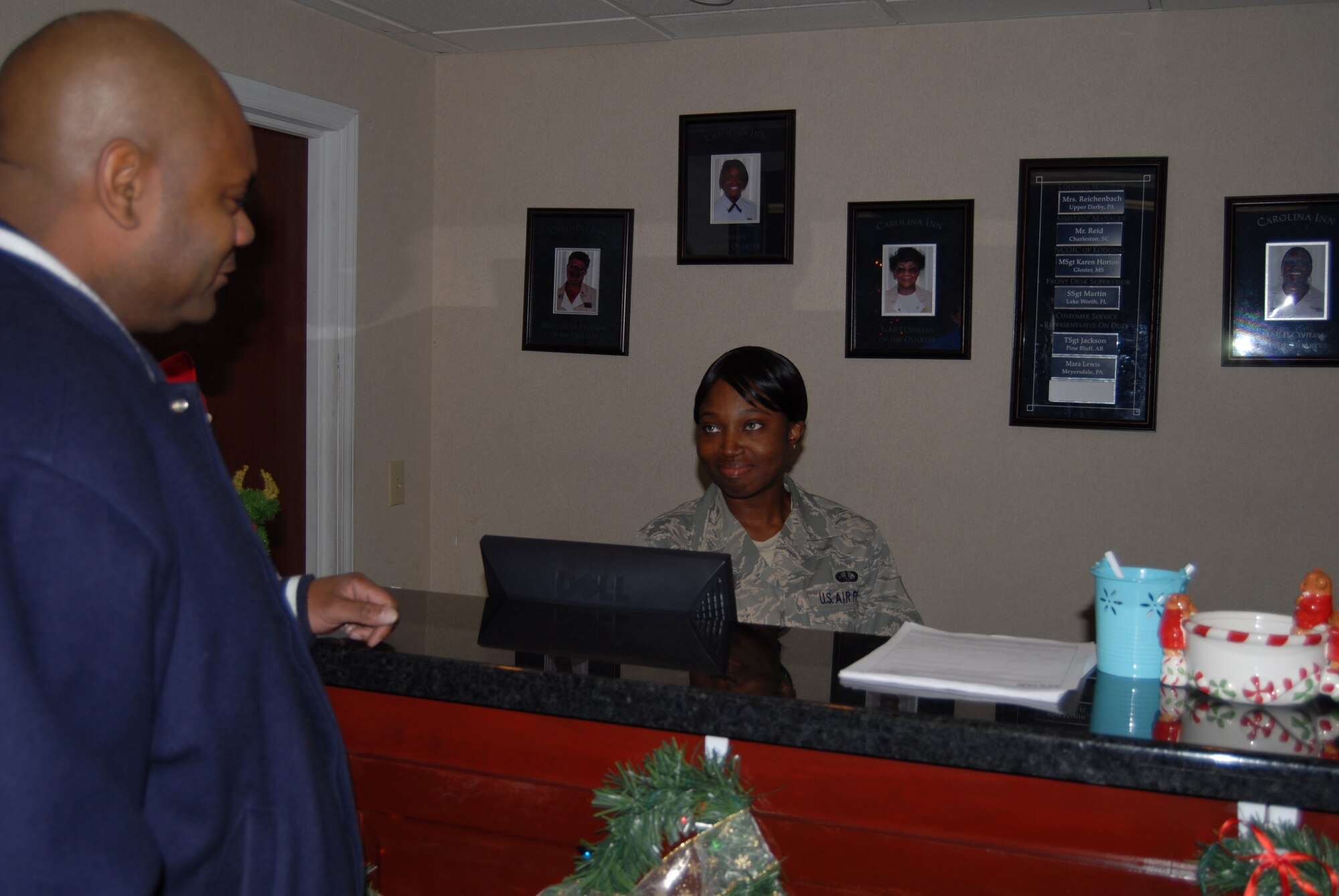 Senior Airman Robyn Watson, 43rd Force Support Squadron, waits on a customer at the Carolina Inn Dec. 31. Airman Watson worked the 3 to 11 p.m. shift on New Year’s Eve and said she did not mind working over this holiday as she was given the Christmas holiday off. Airman Watson is from Charleston, S.C. and was able to spend time with family at Christmas.
“We all make sacrifices so that others can spend time with family,” said Airman Watson. “I am glad I got the opportunity to have Christmas off so that someone else could have  the New Year’s holiday to spend with their family. Working the holidays is not that bad and after a while you get used to it.”
(U.S. Air Force Photo by Tech Sgt. Todd Wivell)
