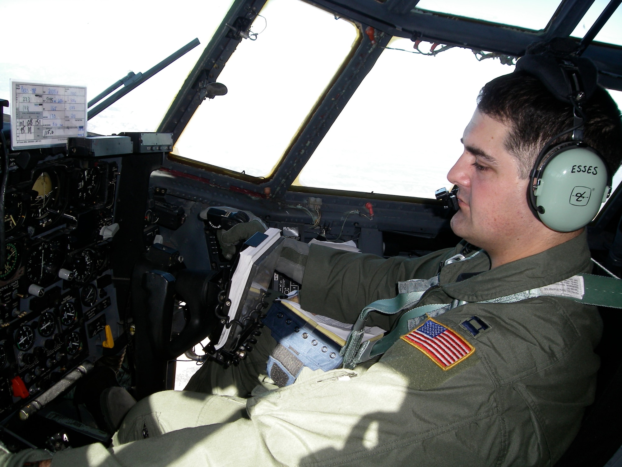 Capt. John Esses, 37th Airlift Squadron, checks his instruments while flying in the Mobility Air Forces Exercise near Nellis Air Force Base, Nev., Nov. 19, 2008. (U.S. Air Force photo by Capt. Mike Trimble)