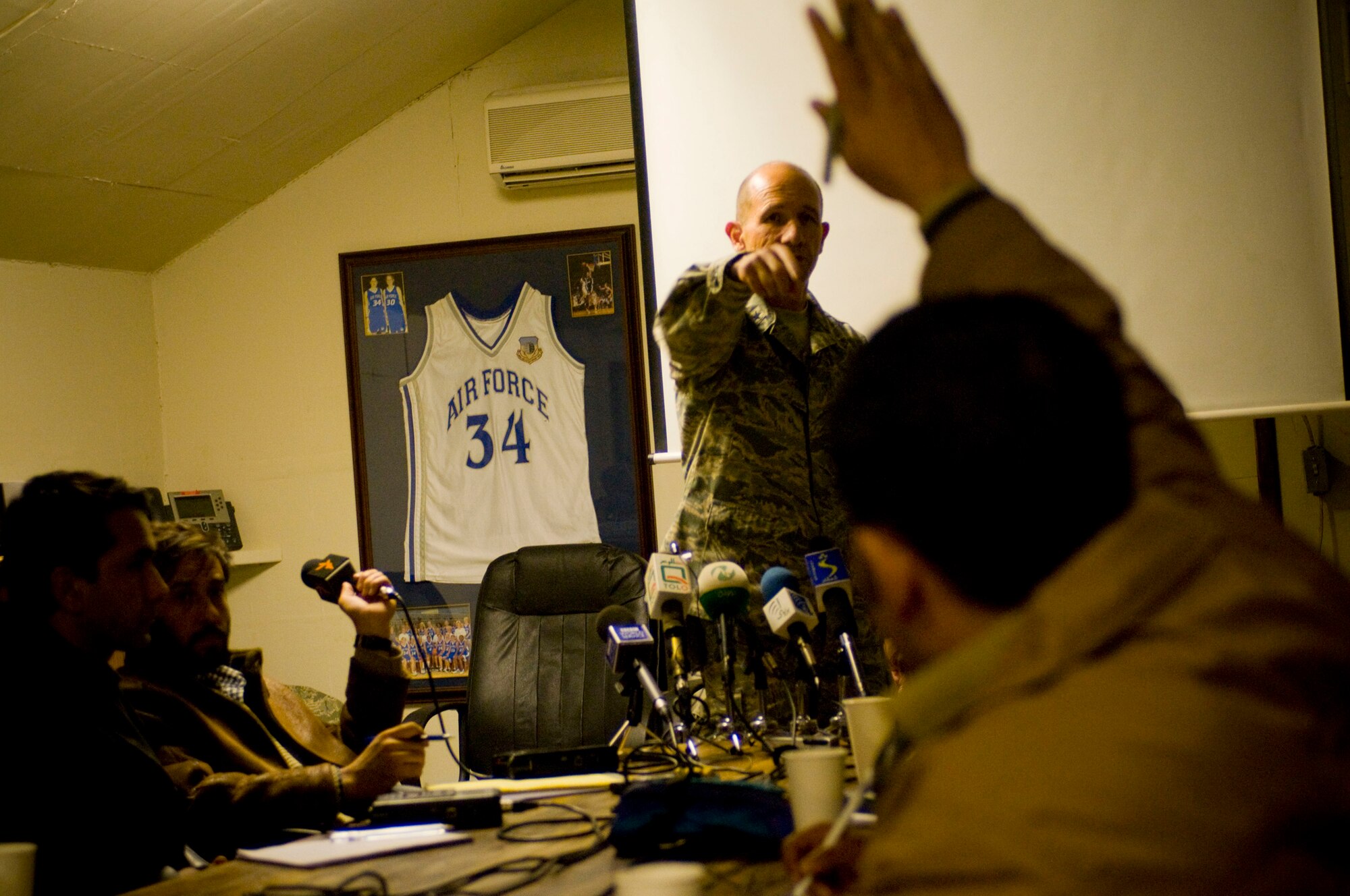 Brig. Gen. Mike Holmes, 455th Air Expeditionary Wing commander, takes a question from an Afghan reporter during Afghan Media Day at Bagram Air Field, Afghanistan, Jan. 5. Following the general's briefing on close air support, many reporters asked about the Air Force's effort to minimize civilian casualties. (U.S. Air Force photo by Staff Sgt. Samuel Morse)(released)