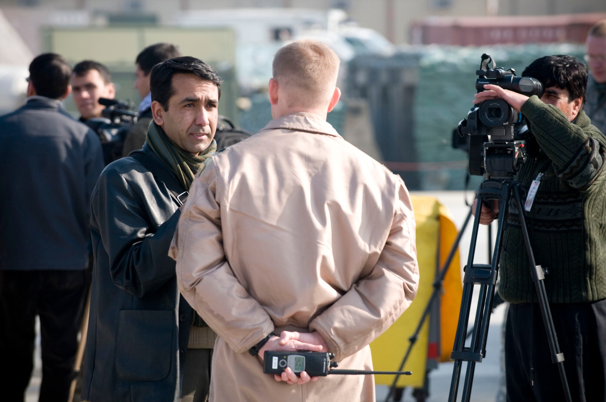 Lt. Col. Derek Oaks, an A-10 Thunderbolt II pilot, is interviewed by a reporter from the Kabul division of BBC at Bagram Air Field, Afghanistan, Jan. 5. As part of Afghan Media Day, local reporters had a chance to see fighter aircraft up close, interview air crew and learn about the 455th Air Expeditionary Wing's close air support mission. (U.S. Air Force photo by Staff Sgt. Samuel Morse)(released)