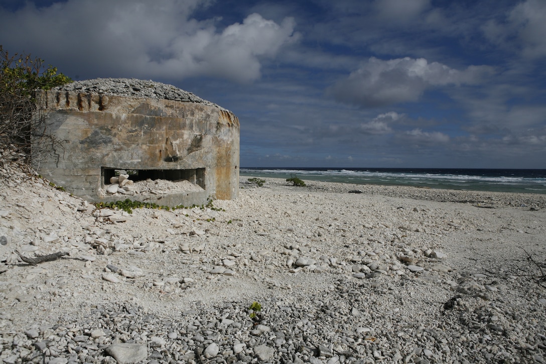 A crumbling bunker serves as a testament to the Japanese's hold on Wake Island from 1942-1945. Approximately 100 U.S. and Japanese historical structures from bunkers to gun placements remain on the island. On Jan. 8, 2009, approximately 60 Marines from Marine Attack Squadron 211 returned to Wake Island en route to a deployment to Iwakuni, Japan. The visit marked the first time since 1993 the bulk of the squadron, nicknamed the "Wake Island Avengers" after the original defenders where killed or captured by Japanese forces during the island's siege, has returned to the remote Pacific atoll. VMA-211 is based in Yuma, Ariz. (Photo by Gunnery Sgt. Bill Lisbon)