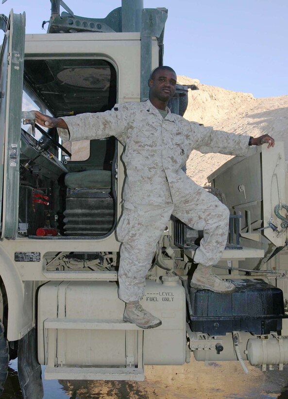 AL ASAD AIR BASE, Iraq (Nov. 17, 2005)  - Nigerian-born Cpl. Chijioke I. Okereke, a motor transport operator for Regimental Combat Team-2, left his native country to pursue college and eventually found the Marine Corps. Arriving in Iraq more than nine months ago, Okereke has been on numerous convoys and mission throughout the area supporting operations in the Global War on Terrorism. (Official Marine Corps photo by Cpl. Adam C. Schnell)