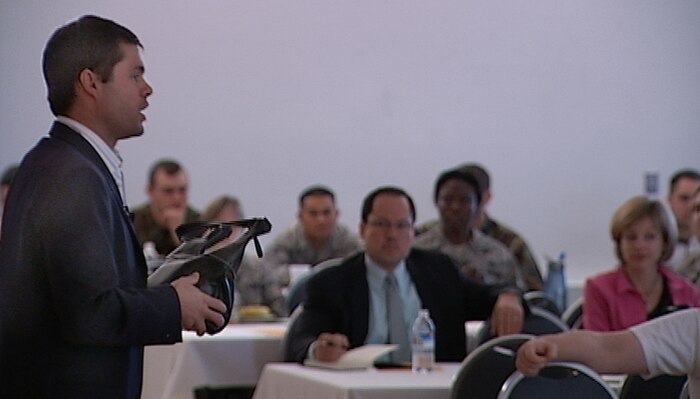 John Sileo, author of an award winning book on identy theft prevention and leading public speaker on ID theft, talks to a group of Beale members at the Financial Roadshow held at the Community Center Jan. 7. Mr. Sileo used an audience members's purse to demonstrate how easy it can be for someone to steal identities. The free roadshow featured briefings by several financial experts, workshops and individual personal financial counselor consultations. (Photo by Karen Savage)