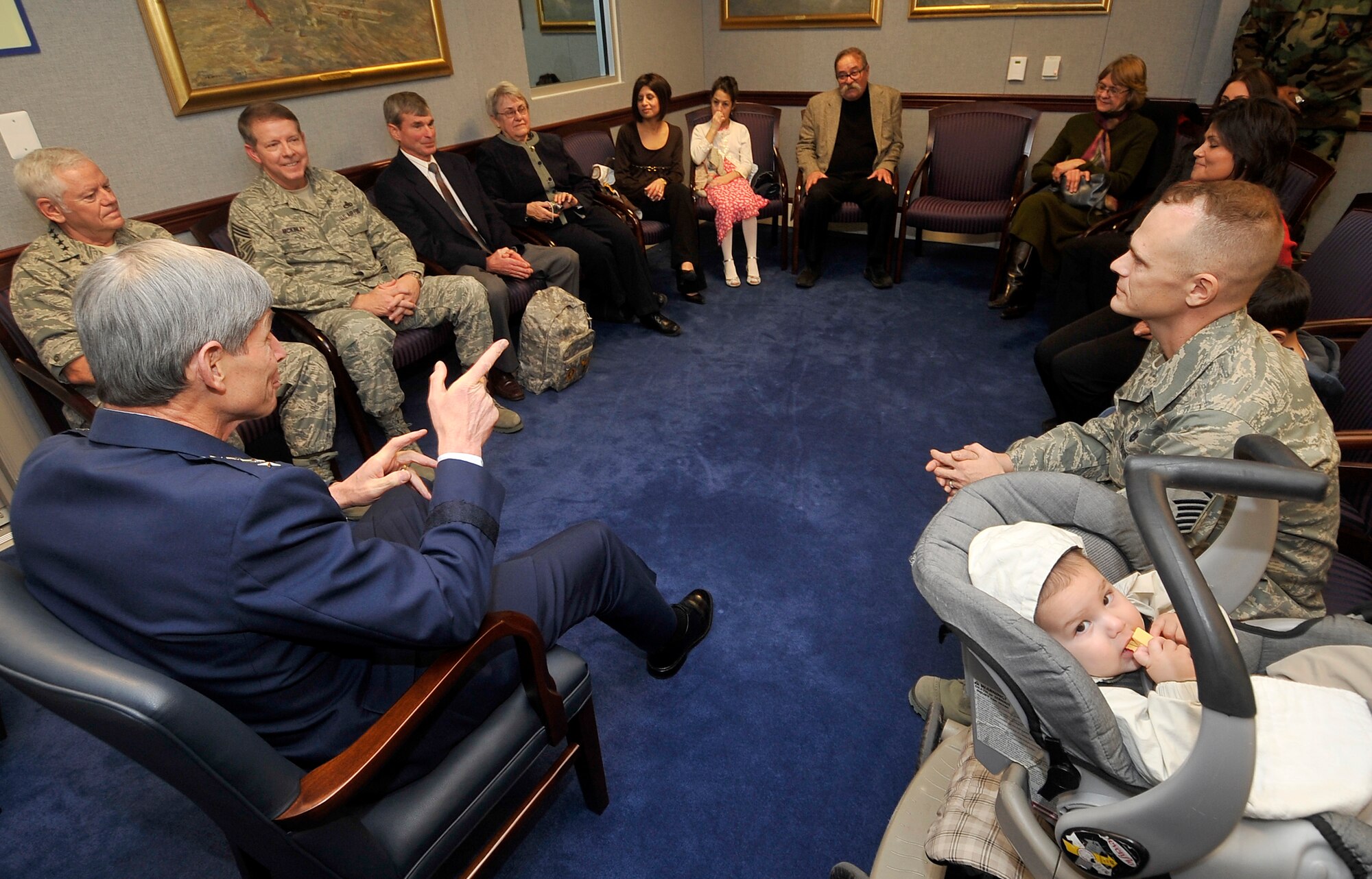 Gen. Norton Schwartz, Air Force chief of staff, and Master Sgt. David Webber (right) chat Jan. 8 in a Pentagon meeting room prior to Sergeant Webber receiving the Purple Heart medal.  (U.S. Air Force photo/Scott M. Ash)