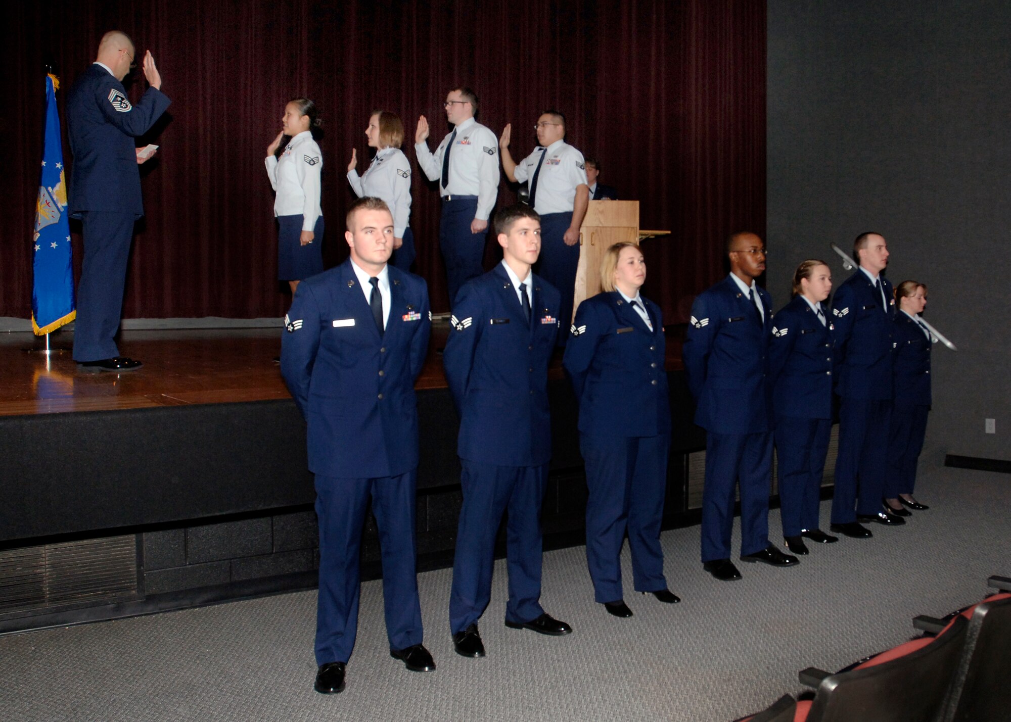FAIRCHILD AIR FORCE BASE, Wash. – Chief Master Sgt. David Nordel, 92nd Air Refueling Wing command chief, leads newly promoted staff sergeants in the non-commissioned officer charge during the Wing Promotion Ceremony at the base theater Dec. 31. (U.S. Air Force photo / Airman 1st Class Melissa L. Barnett)