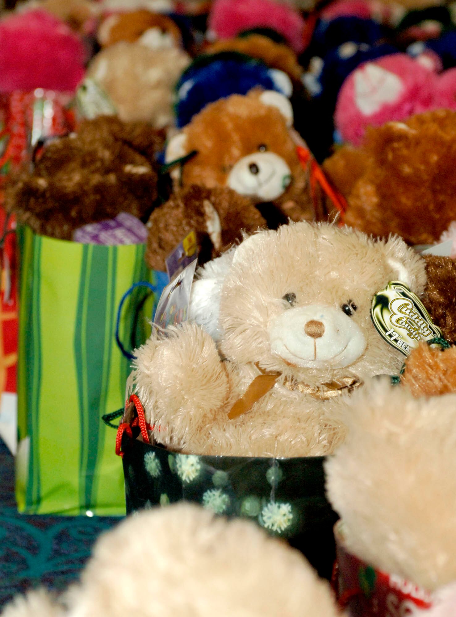 FAIRCHILD AIR FORCE BASE, Wash. – Three hundred gift baskets containing teddy bears and treats were made by the local community Dec. 16. The gift baskets were distributed to children of deployed servicemembers. Making morale baskets is a way the Kalispel Tribe, Northern Quest Casino and Operation Spokane Heroes show the community they care. "It's a project I look forward to every year. It's a lot of hard work.” said Jennifer Simmons, community relations coordinator for Northern Quest Casino. “It doesn't look like it by seeing the baskets, but it takes a lot of planning and a lot of devotion. It's just one way that the Kalispel Tribe and Northern Quest Casino give back to the community. It's just a labor of love, and every year we just adore doing it." (U.S. Air Force photo / Airman 1st Class Darlene West)