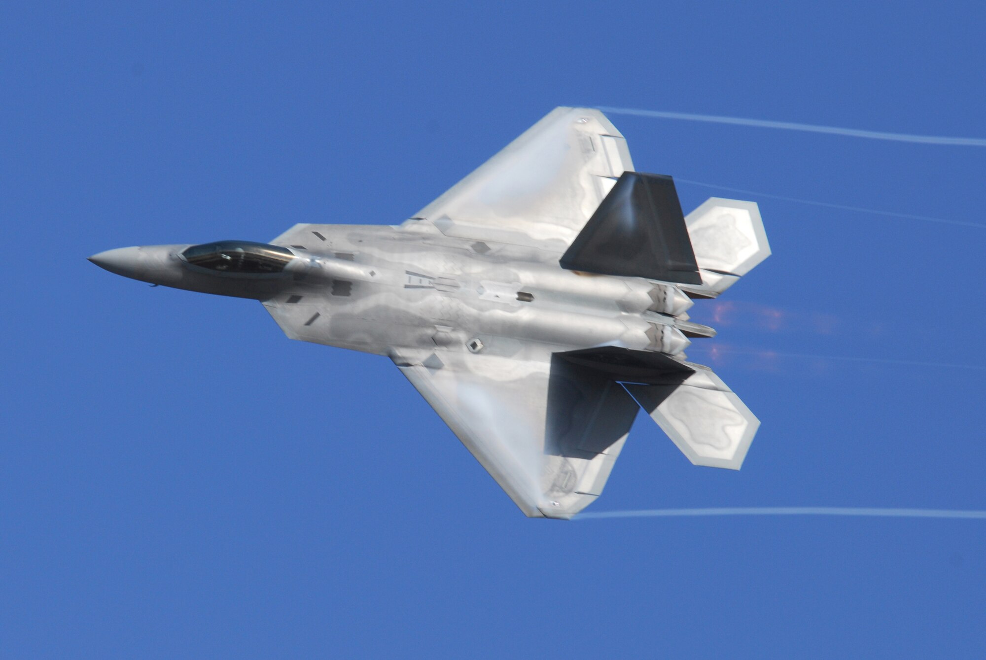 Maj. David “Zeke” Skalicky, United States Air Force Air Combat Command F-22 Raptor Demonstration Team member and former 43rd Fighter Squadron American Hornet, conducts a training sortie at Tyndall Air Force Base Tuesday combining a series of advanced handling maneuvers for the F-22 2009 season. This sortie was one of the new team’s first off-station flights for the 2009-2010 season. (U.S. Air Force photo by Lisa Norman)