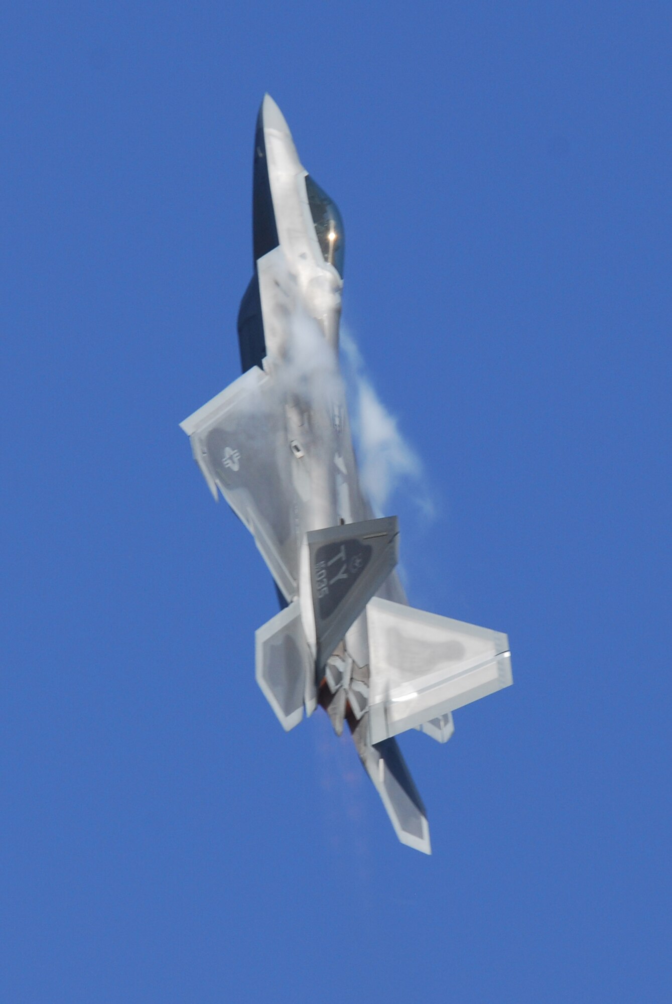 Maj. David “Zeke” Skalicky, United States Air Force Air Combat Command F-22 Raptor Demonstration Team member and former 43rd Fighter Squadron American Hornet, conducts a training sortie at Tyndall Air Force Base Tuesday combining a series of advanced handling maneuvers for the F-22 2009 season. This sortie was one of the new team’s first off-station flights for the 2009-2010 season. (U.S. Air Force photo by Lisa Norman)