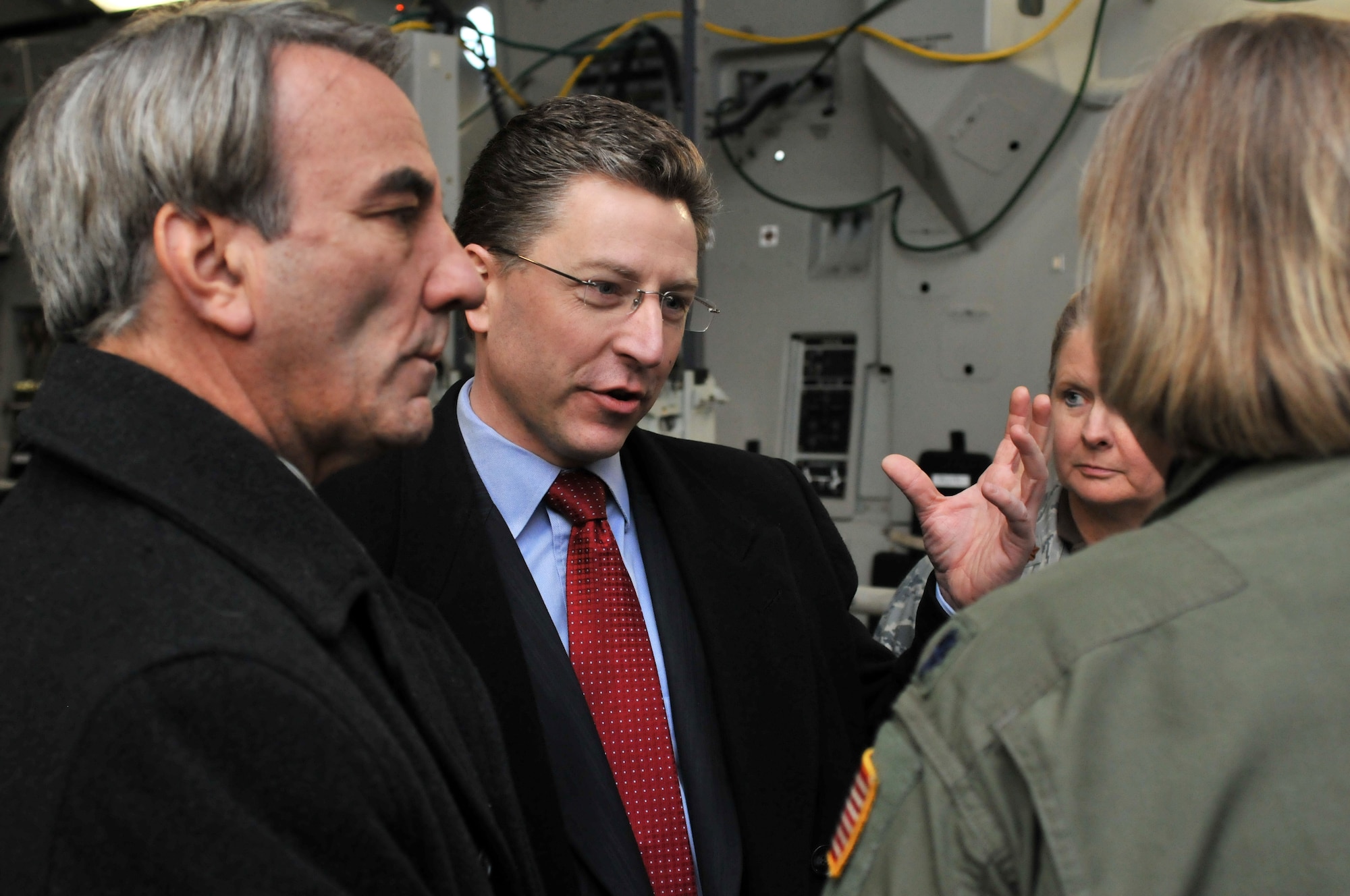 Ambassador Kurt Volker (middle), U.S. Permanent Representative to NATO, and Mr. W. Bruce Weinrod (left), Secretary of Defense Representative, Europe & Defense Advisor, US Mission to NATO, talk with medical professionals during a visit today to Ramstein Air Base, Germany. Mr. Weinrod accompanied Ambassador Volker to visit Gen. Roger Brady, USAFE commander, to discuss USAFE’s roles and mission in Europe, to include USAFE’s participation in Baltic Air Policing and the newly formed Heavy Airlift Wing at Papa, Hungary. In addition to briefings and a visit with CC-Air NATO,  Ambassador Volker and Mr. Weinrod were also able to witness first-hand how patients arriving from Iraq and Afghanistan are moved from Germany to the United States on aeromedical evacuation flights. (U.S. Air Force photo by Senior Airman Nathan Lipscomb)