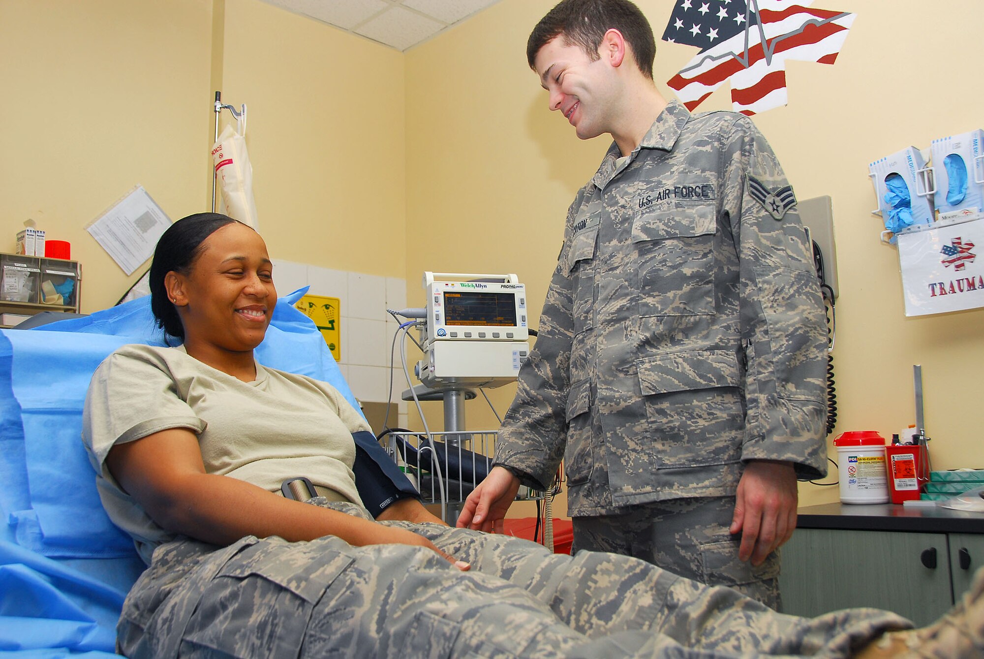 Senior Airman Jesse Caton, 386th Expeditionary Medical Group, simulates treating a patient at a base in Southwest Asia. Airman Caton is deployed from the 88th Inpatient Operations Squadron at Wright-Patterson Air Force Base, Ohio. (U.S. Air Force photo by Staff Sgt. Shawn Volle)