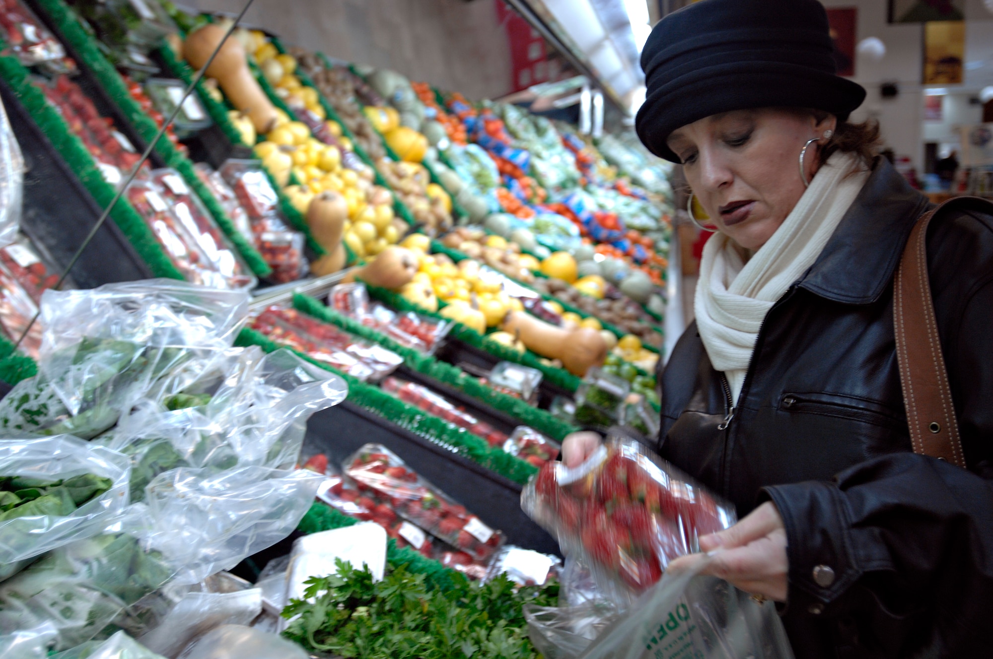 Karey Brown, wife of Senior Master Sgt. Kerry Brown, shops for fresh strawberries at Incirlik’s commissary, Jan. 6. Most fresh produce provided by Incirlik’s commissary is ordered from warehouses in Germany and inspected before being placed on the shelf. (U.S. Air Force photo/Senior Airman Benjamin Wilson)