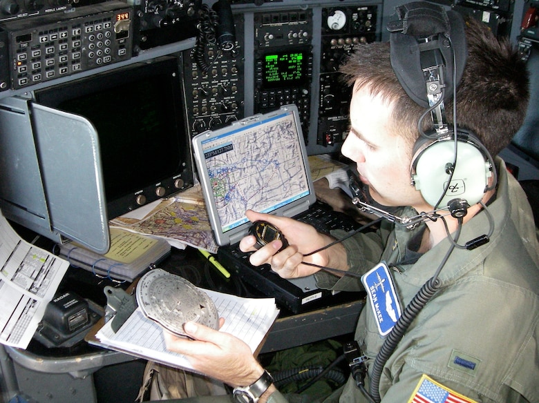 1st Lt. Sean McKee, 37th Airlift Squadron, checks his ground speed and timing to the next turn point during the Mobility Air Forces Exercise at Nellis Air Force Base, Nev., Nov. 19, 2008.  Lieutenant McKee and his crew flew in a 16-ship airdrop formation during the semiannual exercise planned by the US Air Force Mobility Weapons School. (U.S. Air Force photo by Capt. Michael Trimble)