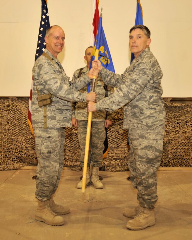 01/09/2009 - SATHER AIR BASE, Iraq - Col. Jon Andre, 447th Air Expeditionary Group commander (left), pass command of the 447th Expeditionary Civil Engineer Squadron to Lt. Col. Waylon Blakeley in a ceremony at Sather Air Base in Baghdad Jan. 9. Colonel Blakeley is a Tennessee Air National Guard member deployed from the 117th Air Refueling Wing, Birmingham, Ala. (U.S. Air Force photo by Master Sgt. Brian Davidson)