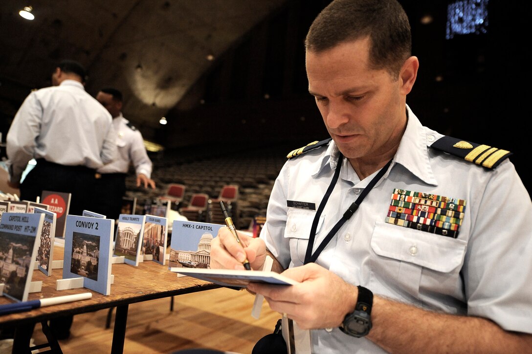 U.S. Coast Guard Lt. Cmdr. Daryl Schaffer of the Armed Forces Inaugural Committee, marks the back of a map icon as part of his participation  in a large-scale map exercise at the D.C. Armory in Washington, D.C., Dec. 18, 2008.  