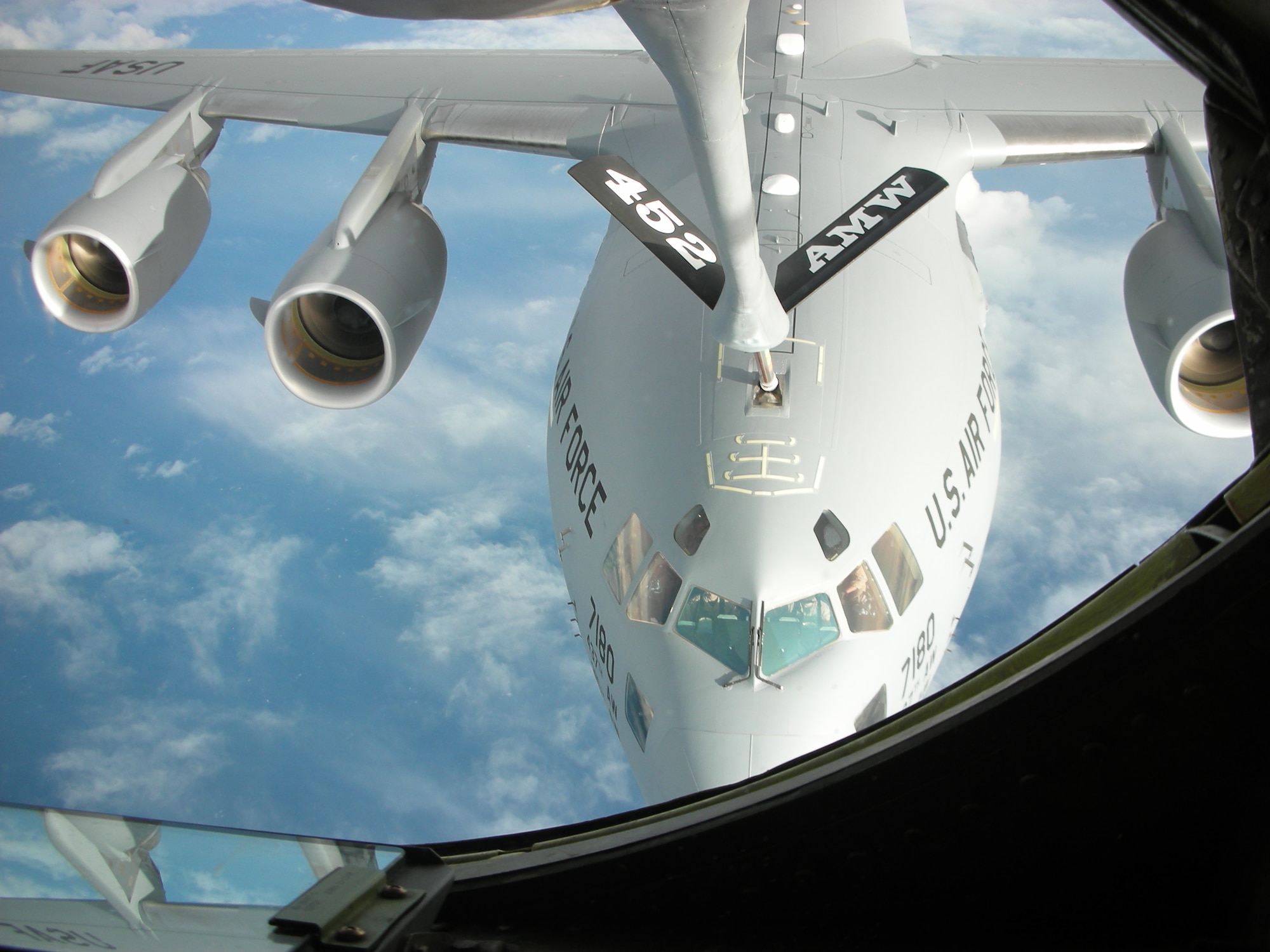 A KC-135 from the 452 AMW refuels a C-17 crew from McChord AFB on Christmas Day. The C-17 is piloted by Lt. Col. Albert Miller, squadron commander, 817
AS and Capt. Shaun Maloney. The last of about 130 members from various units throughout March ARB returned here from Incirlik AB, Turkey, Jan. 4, after wrapping up refueling missions in support of operations in Iraq and Afghanistan. Two KC-135s from the 336 ARS conducted 131 sorties and unloaded 1,000,734 pounds of fuel during the two-month deployment. (U.S. Air Force photo courtesy of Capt. Mary Guest)