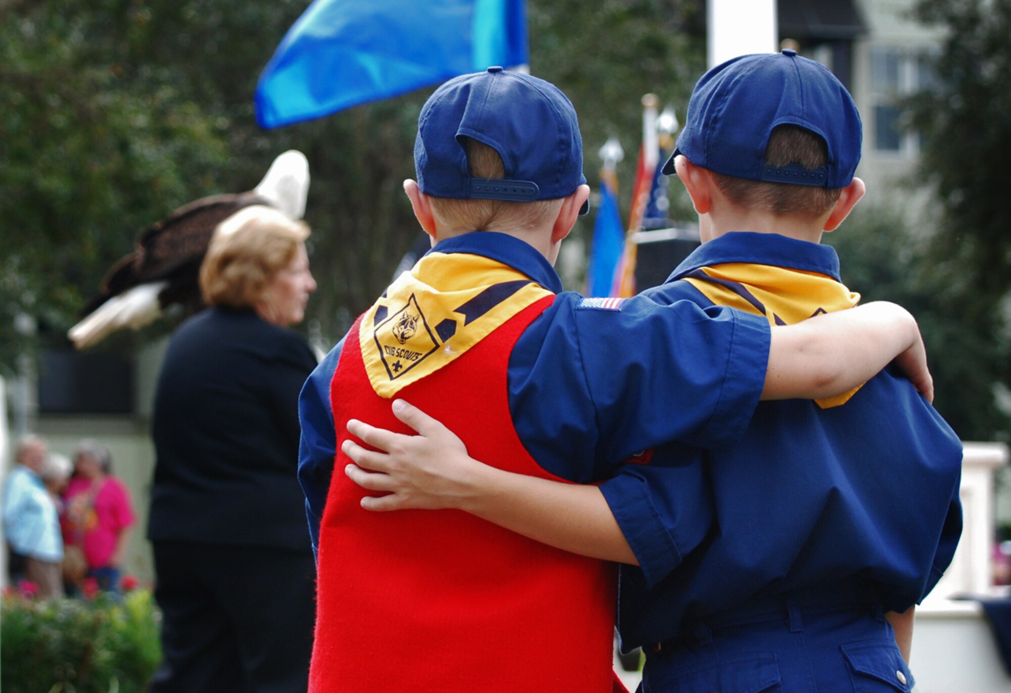 CELEBRATION, Fla. - Members of a local Cub Scout troop console each other during the town's veteran's memorial dedication ceremony. The memorial project was conceived of and initiated by Simon Sharp, a 15-year-old boy who began building the veteran's memorial for his Eagle Scout project but died of leukemia before the project was completed. The 920th Rescue Wing performed an HC-130 flyover during the ceremony. (U.S. Air Force photo/Staff Sgt. Heather Kelly)