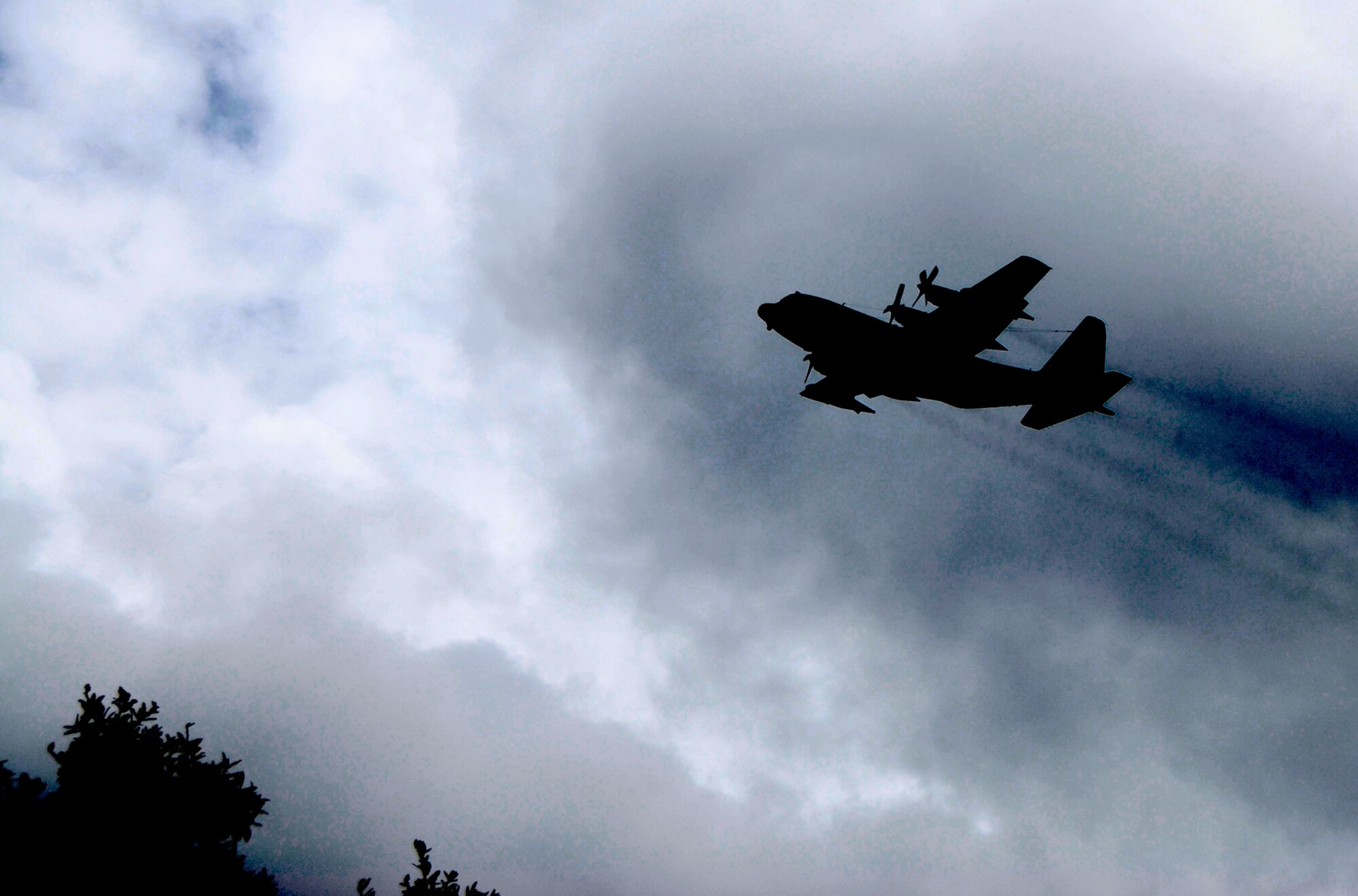 CELEBRATION, Fla. - A 920th Rescue Wing HC-130 glides above the ceremony honoring Simon Sharp, a 15-year-old boy who began building a veteran's memorial for his Eagle Scout project but died of leukemia before the project was completed. (U.S. Air Force photo/Capt. Ian Phillips) 