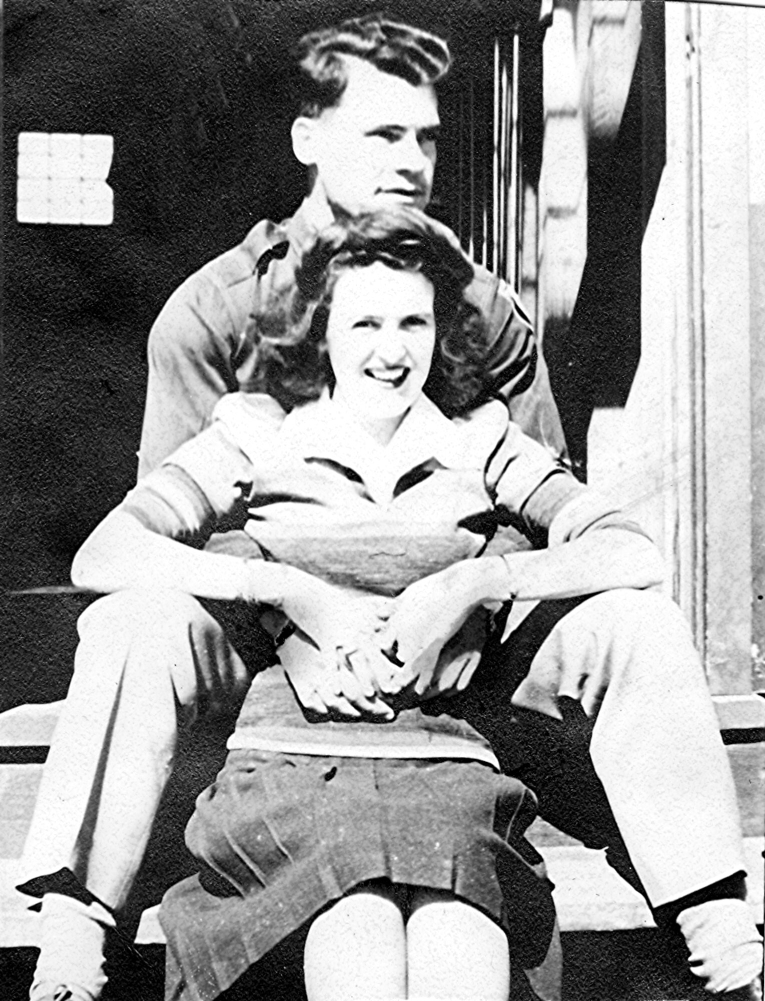 Capt. Joseph “Bernie” LeMay and wife Katherine sit on the steps of the base hospital over 60 years ago. 