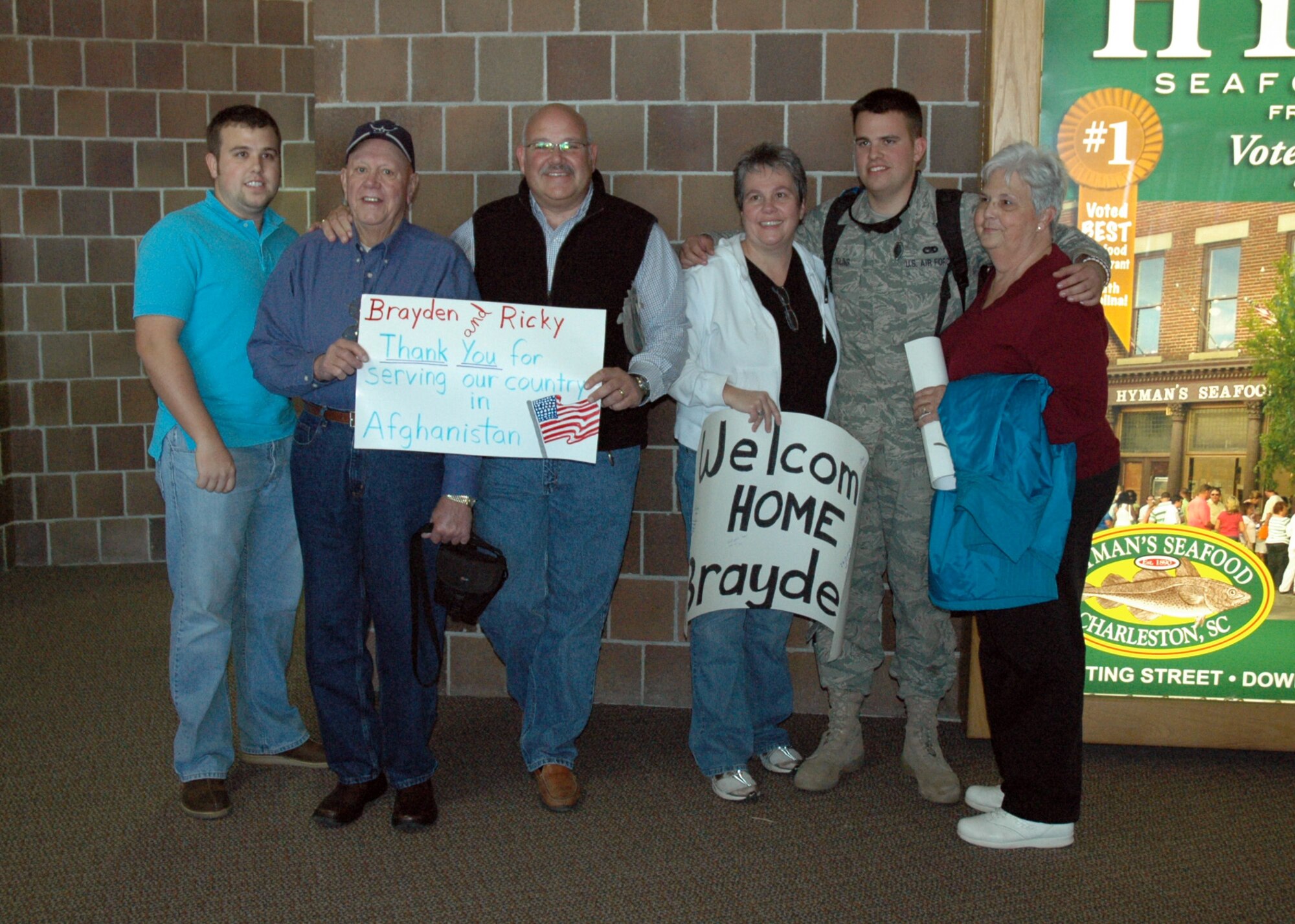 Senior Airman Braydon Young of the 38th Aerial Port Squadron sees his family for the first time after completing a four month deployment.  (U.S. Air Force photo/Technical Sergeant Traci Johnson)