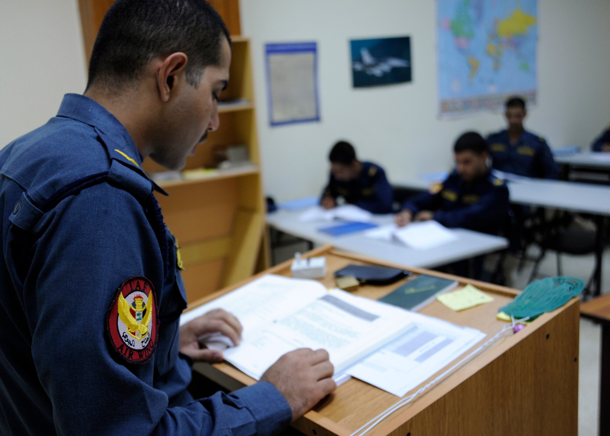 RUSTAMIYAH, Iraq -- An Iraqi cadet reads questions aloud during an English language course at the Iraqi Air Force Training Wing, Forward Operating Base Rustamiyah, Iraq. Reading aloud is a training exercise to help the cadets' enunciate English words correctly. (U.S. Air Force photo/Staff Sgt. Paul Villanueva II)