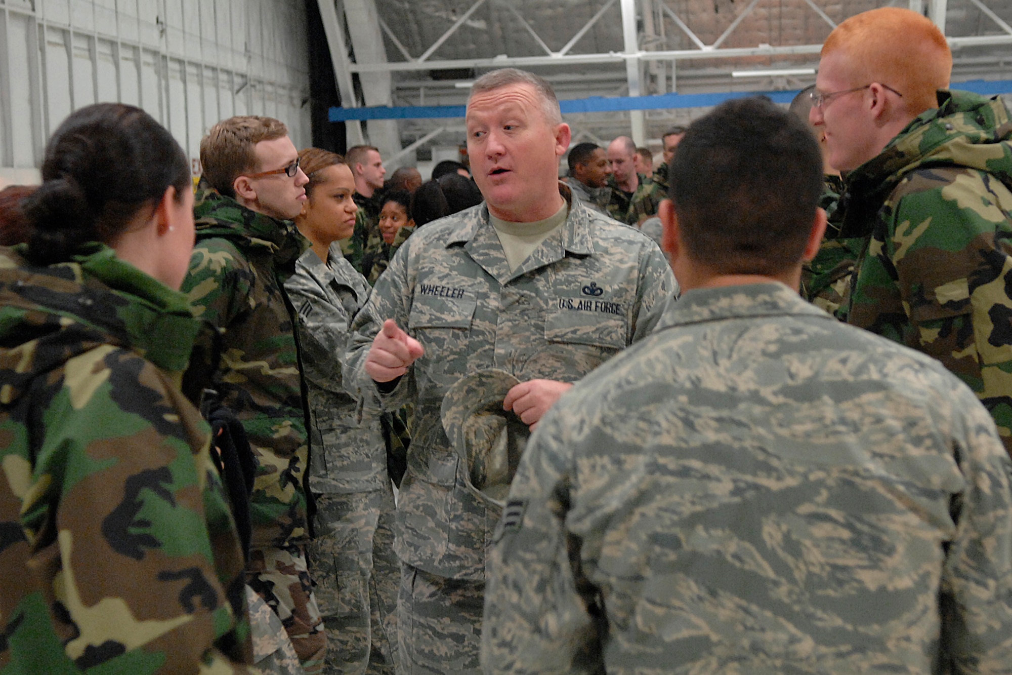 Chief Master Sgt. Paul Wheeler, Air Force District of Washington command chief master sergeant, talks with Airmen about the Air Force Core Values and the importance of their mission during the preparation for the inauguration practice Jan. 11.  More than 5,000 men and women from the Army, Air Force, Navy and Marine Corps are providing military ceremonial support for the presidential inauguration, a tradition dating back to George Washington’s 1789 inauguration. (U.S. Air Force photo by Senior Airman Giang Dong Nguyen)