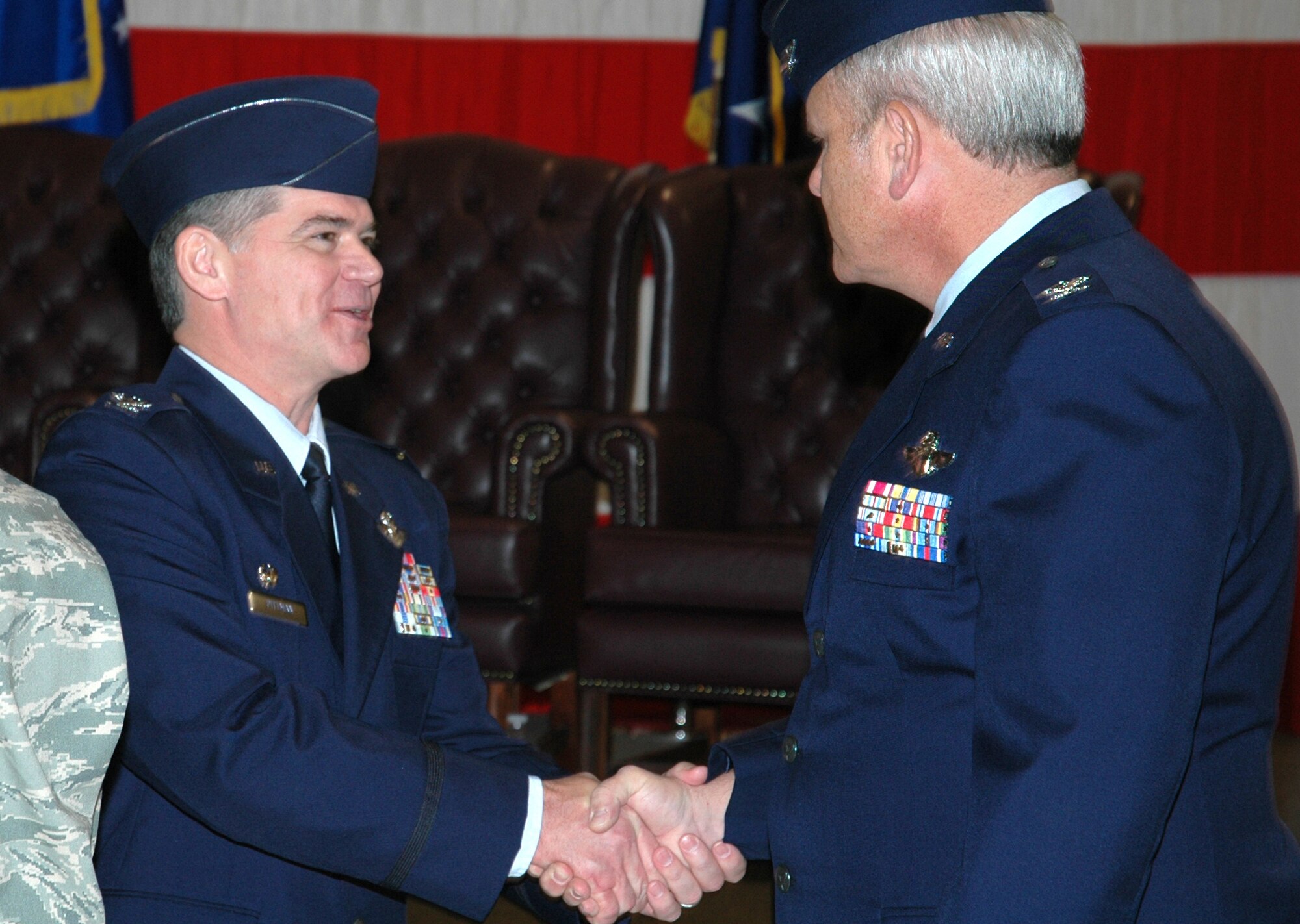 Col. Jack H. Pittman Jr. (left) greets Col. Bob Chapman following a 302nd Airlift Wing change of command ceremony Jan. 10 at Peterson Air Force Base, Colo. Colonel Pittman replaced Col. James J. Muscatell, Jr. as the new commander of 302nd AW. Colonel Chapman is the vice commander of the 302nd AW. (U.S. Air Force photo/Tech. Sgt. Daniel Butterfield)