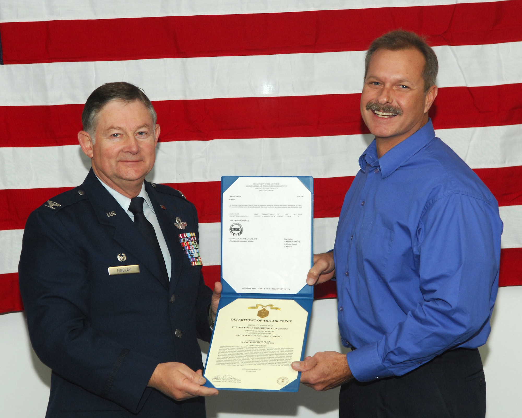 Col. Kelvin Findlay, 151st Air Refueling Wing Commander, presents the Air Force Commendation Medal to Master Sgt. Richard Woodfall.  Sgt. Woodfall retired from the 299th Range Control Squadron after having served as an air traffic controller and unit career advisor for the unit.  The 299th RCS retired 14 squadron members as part of a drawdown of personnel as the unit prepares to deactivate later this year.
U.S. Air Force photo by Master Sgt. Burke Baker 