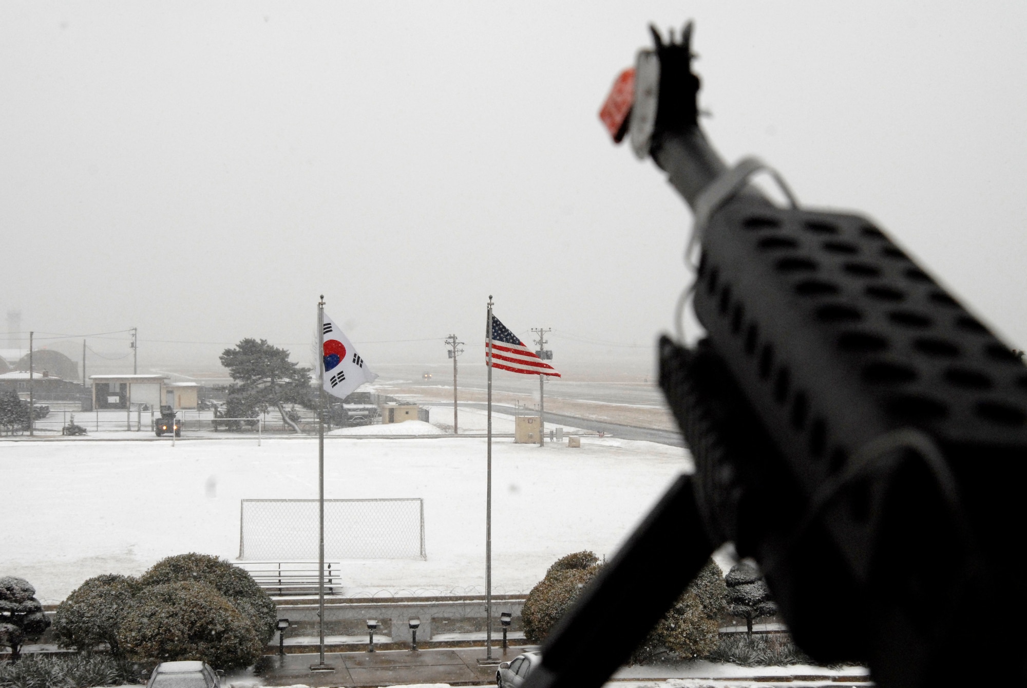 The snow and temperature continue to fall during the Peninsula Wide Operational Readiness Exercise at Kunsan Air Base, Republic of Korea, Jan. 11, 2009. Kunsan is participating in the PENORE as a test of its wartime capabilities and response actions. (U.S. Air Force Photo by SSgt Jason Colbert)