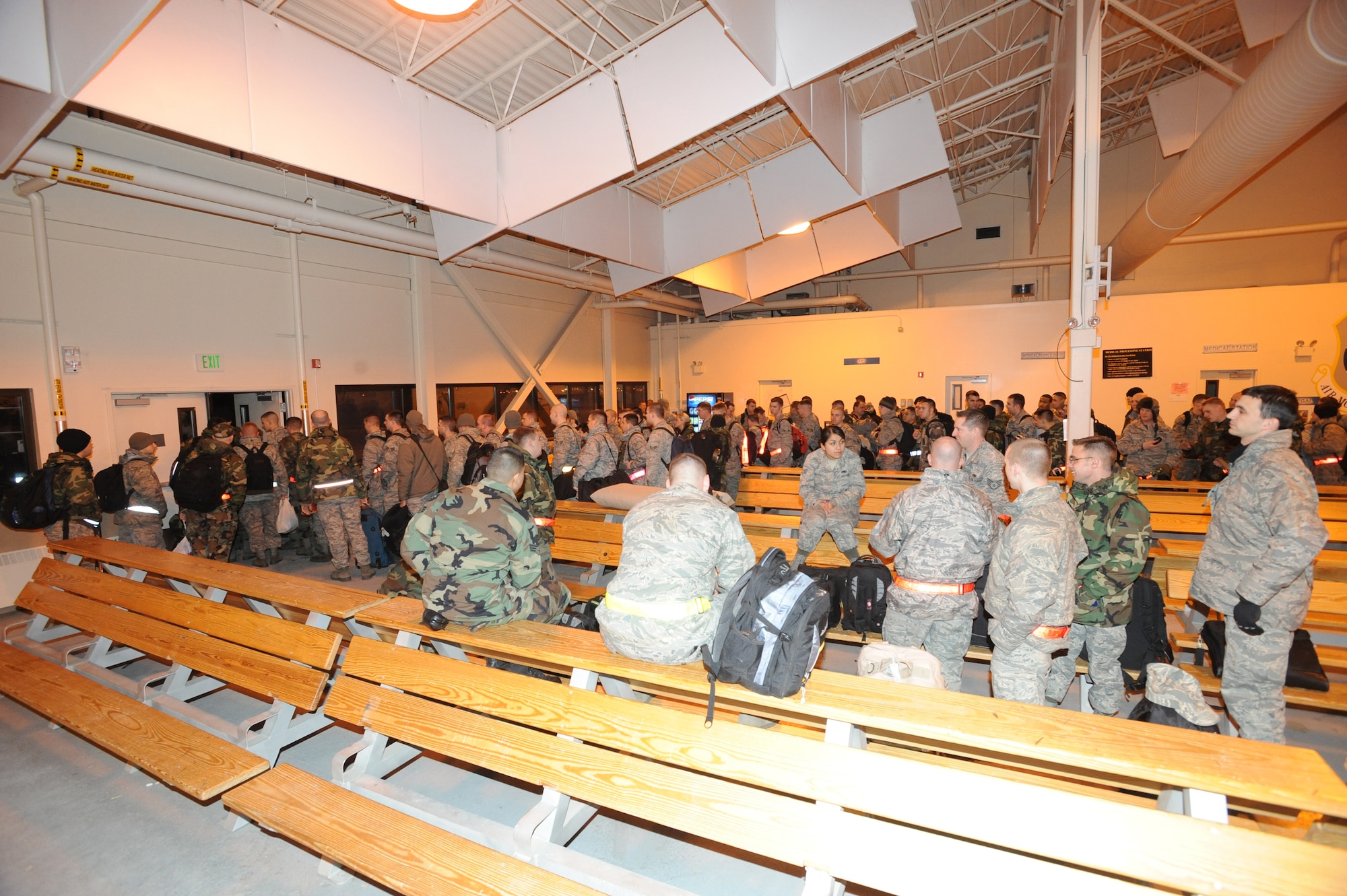 ELMENDORF AIR FORCE BASE, Alaska-- Airmen from the 90th Fighter Squadron  wait to board their C-17 for the first F-22 AEF deployment, Jan. 9.The 90th Fighter Squadron will be deploying to Guam for a 90- day rotation to test the real world deployment capabilities of the F-22. (U.S. Air Force photo/ Senior Airman Matthew Owens)