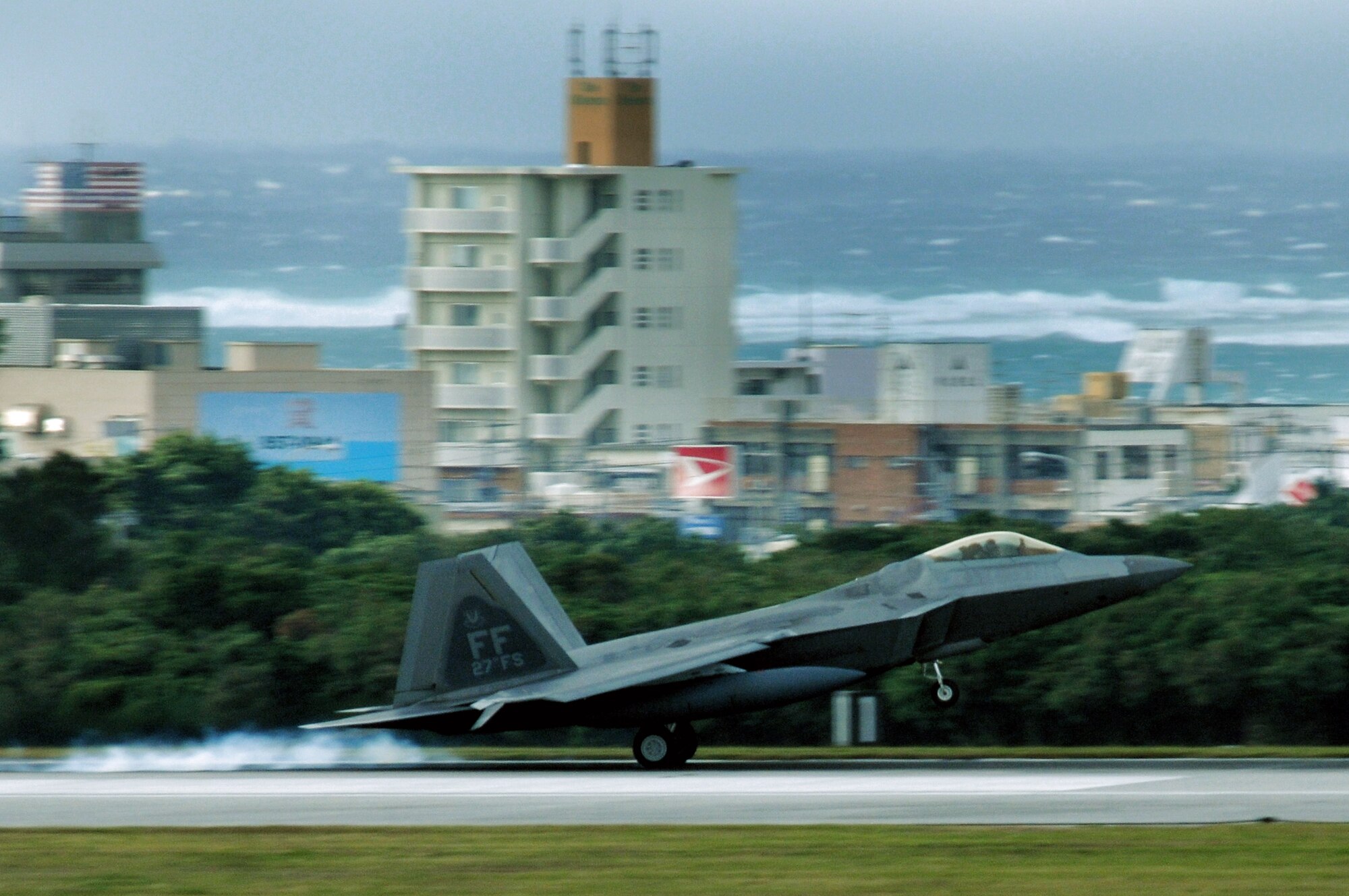 An F-22 Raptor lands at Kadena Air Base, Japan, Jan. 10. The aircraft is one of 12 deployed from Langley Air Force Base, Va., as part of an air expeditionary force rotation. (U.S. Air Force photo/Airman 1st Class Chad Warren)