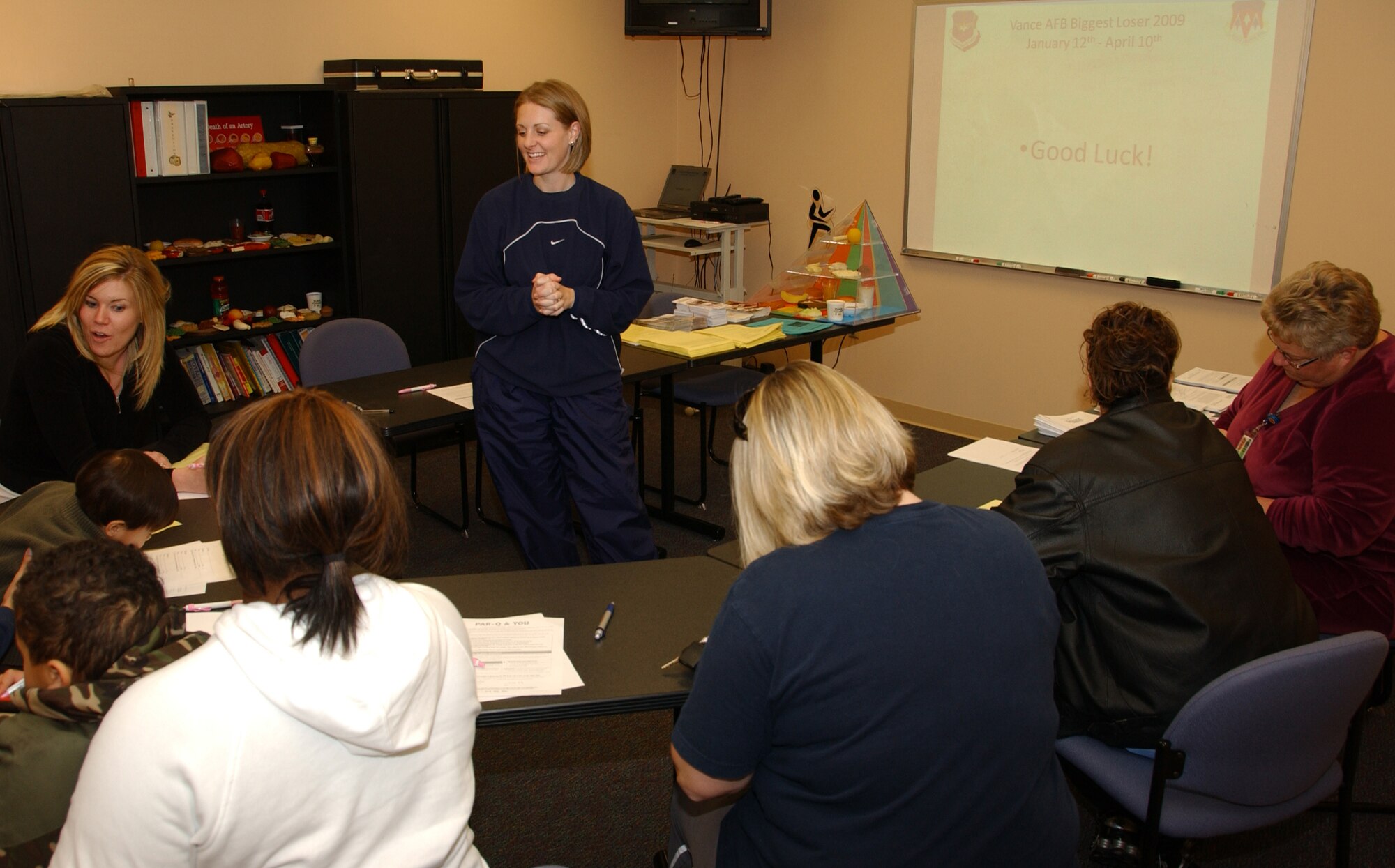 Kellie Jensen, Vance fitness program manager, gives an initial briefing to participants of the 2009 Biggest Loser competition here, organized through the Health and Wellness Center. Through April 10, teams of four will compete to lose the most weight. Team members will be weighed in once a month. In order to help teams along, the HAWC will offer fitness and nutrition classes each month of the competition. This is the second year for the competition here. (U.S. Air Force photo by Staff Sgt. Brian Hill)