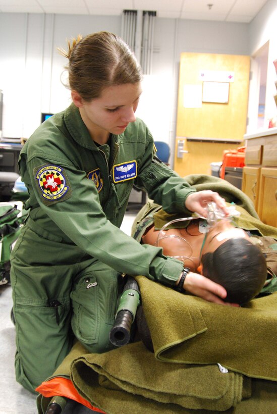 ANDREWS AIR FORCE BASE, Md. -- Senior Airman Hope Waldron, 459th Aeromedical Staging Squadron, aerospace medical technician, places a non-rebreathing oxygen mask on a mannequin to provide realistic simulation for patient care. (U.S. Air Force photo/ Senior Airman Ashley Crawford)