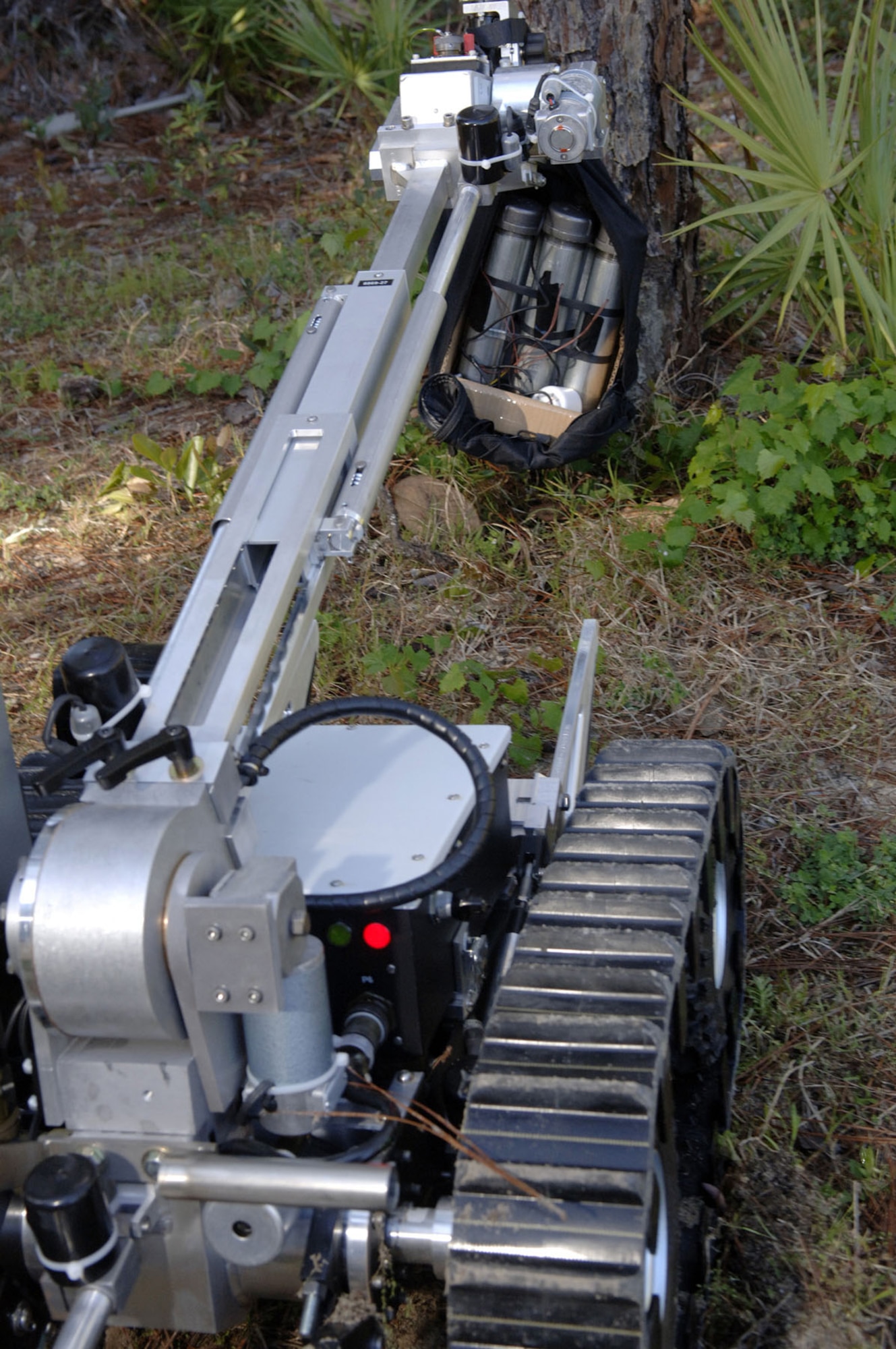 Robotic devices have lessened the danger of handling suspicious packages and unexploded ordnance. This photo highlights using a camera attached to the robot. (U.S. Air Force photo)