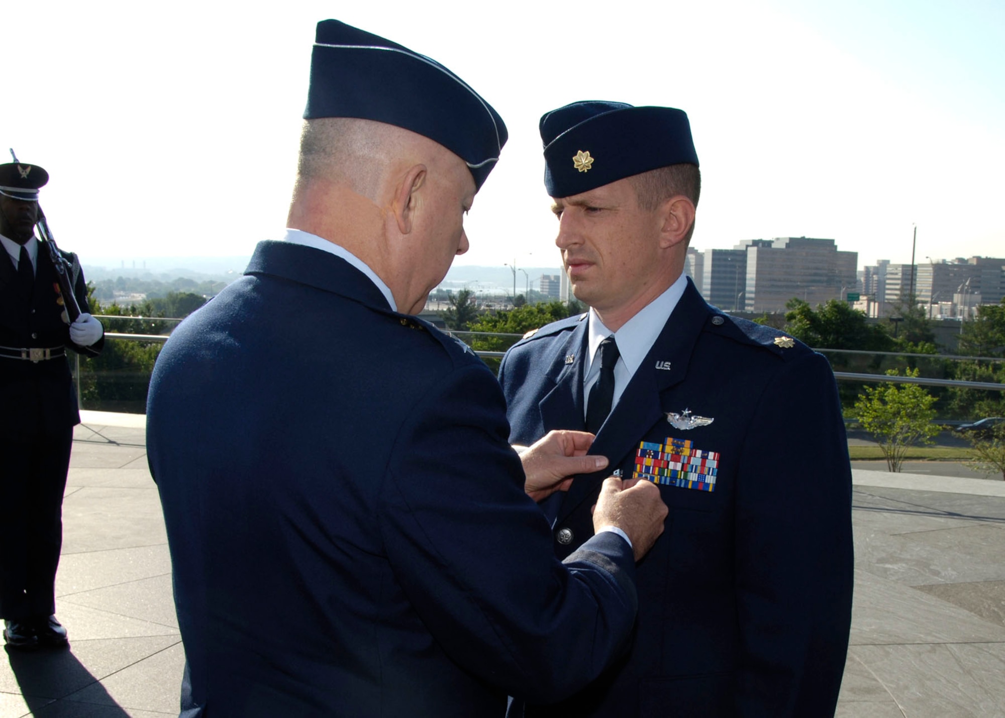 As the ranking officer of the awardees, Maj. Steven Raspet had the Combat Action Medal pinned on first. Here, then-USAF Chief of Staff T. Michael Moseley pins the medal onto Maj. Raspet. (U.S. Air Force photo)