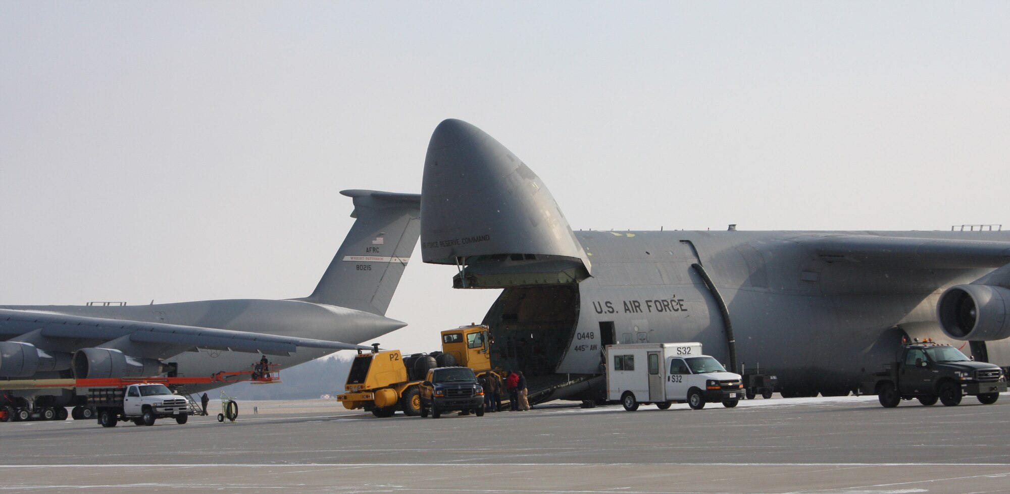 WRIGHT-PATTERSON AFB, Ohio - A snow plow is loaded onto a 445th Airlift Wing C-5 aircraft Jan. 9, 2009, during a training exercise.  The snow plow provides the right combination of large and heavy equipment for training purposes.  The C-5 is the largest aircraft in the Air Force inventory and can carry a maximum cargo weight of 270,000 pounds. (Air Force photo/Stacy Vaughn) 
