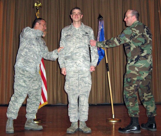 Tech. Sgt. Thomas Young, 57th Component Maintenance Squadron’s F-15/F-16 avionics assistant production supervisor, gets his STEP promotion stripes pinned on by Tech. Sgt. Christopher Renziehausen, 57th CMS day shift production supervisor (left), and Tech. Sgt. Terry Suhre, CMS, F-15 assistant noncommissioned officer in charge, Dec. 29. Sergeant Young was notified of his promotion Dec. 25. (Courtesy photo)