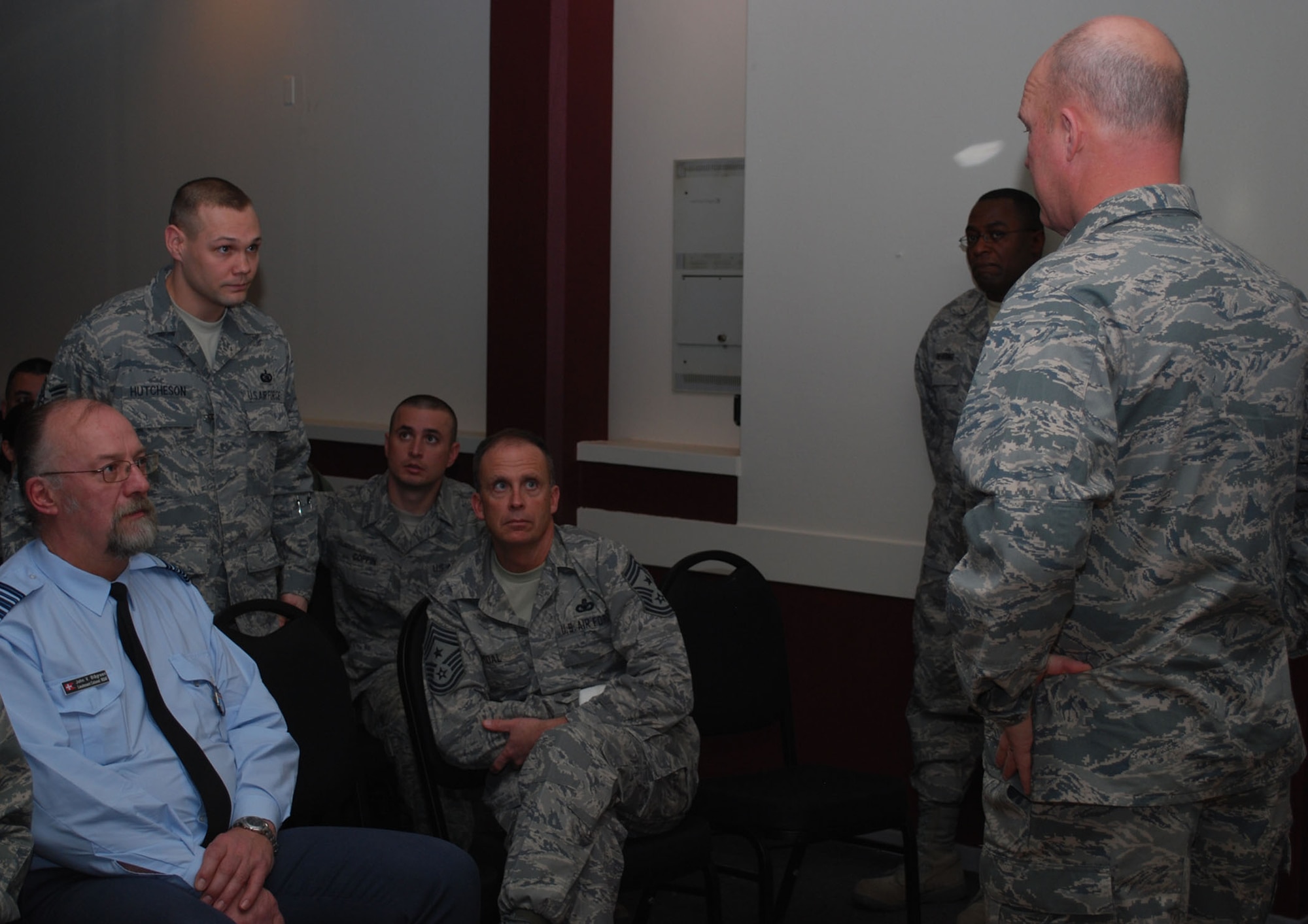 Tech. Sgt. Gary Hutcheson, 821st Support Squadron, asks Col. Jay Raymond, 21st Space Wing commander, about bringing college-level testing to Thule during Colonel Raymond's commander's call at the Top of the World Club Jan. 7. Colonel Raymond and Chief Master Sgt. Tim Omdal, 21st Space Wing command chief, held commander and enlisted calls to talk Air Force issues and take questions and suggestions from Airmen. Long-standing Thule issues that were discussed include implementing college-level testing at Thule, Internet accessibility and developing running facility options (Photos by 1st Lt. Lisa Meiman).