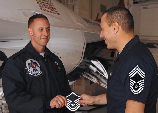 Master Sgt. Dan Lawson, US Air Force Air Demonstration Squadron 2009 Show Line line chief, gets his STEP promotion stripes presented to him by Chief Master Sgt. Thomas Mical, USAFADS chief enlisted manager Jan. 5. Sergeant Lawson was notified of his promotion Dec. 25. (U.S. Air Force Photo by Staff Sgt. Kristi Machado)