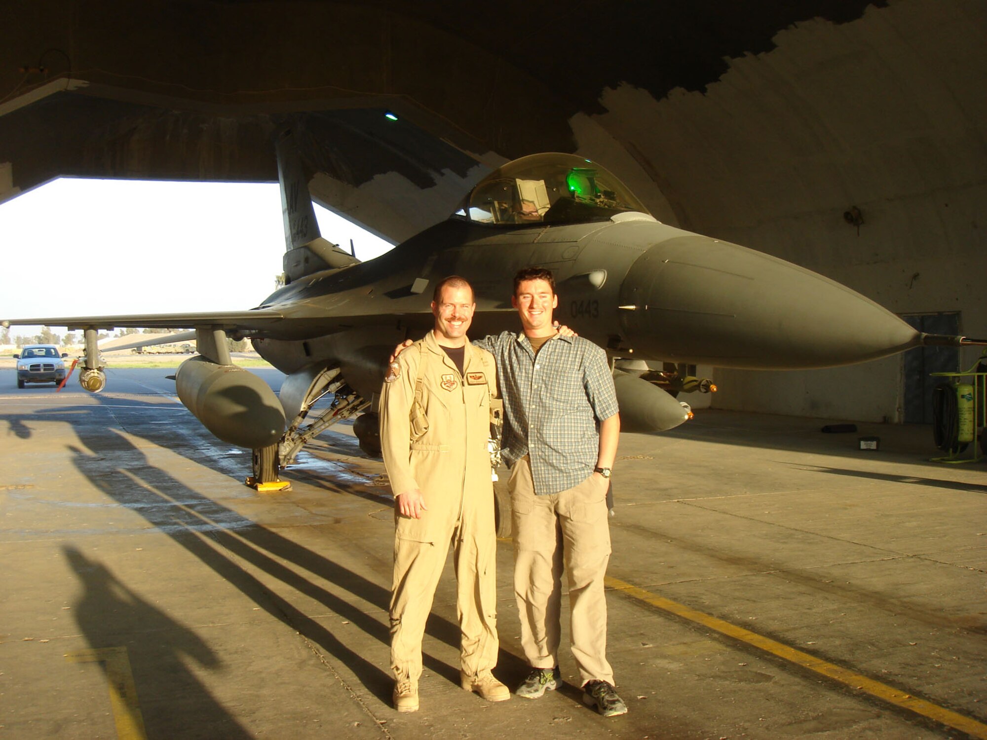At the end of his tour in Iraq, Sgt Wallace (right) visited Maj Marquardt (left).  They are standing in front of the F-16 Marquardt flew that day.