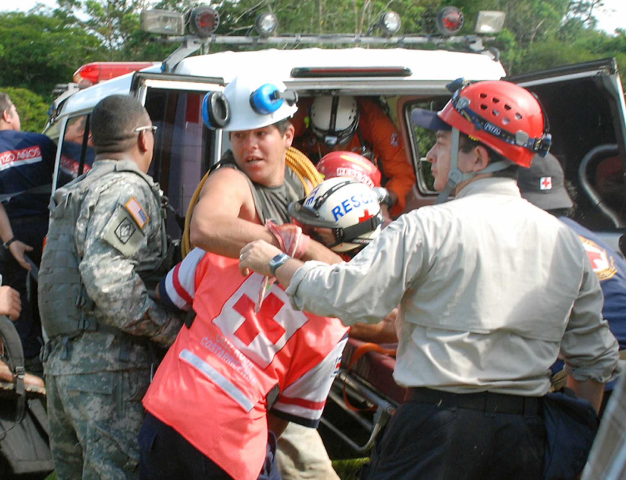Members of the Costa Rican Red Cross load an earthquake victim with a broken leg into an ambulance . 10 in San Miguel, Costa Rica. The man was rescued by Joint Task Force-Bravo members via an UH-60 Blackhawk. Four JTF-Bravo helicopters and 34 American servicemembers deployed here from Soto Cano Air Base, Honduras, at the request of the Costa Rican government in order to provide lifesaving support to those affected by the earthquake. (U.S. Air Force photo/1st Lt. Candace Park)
