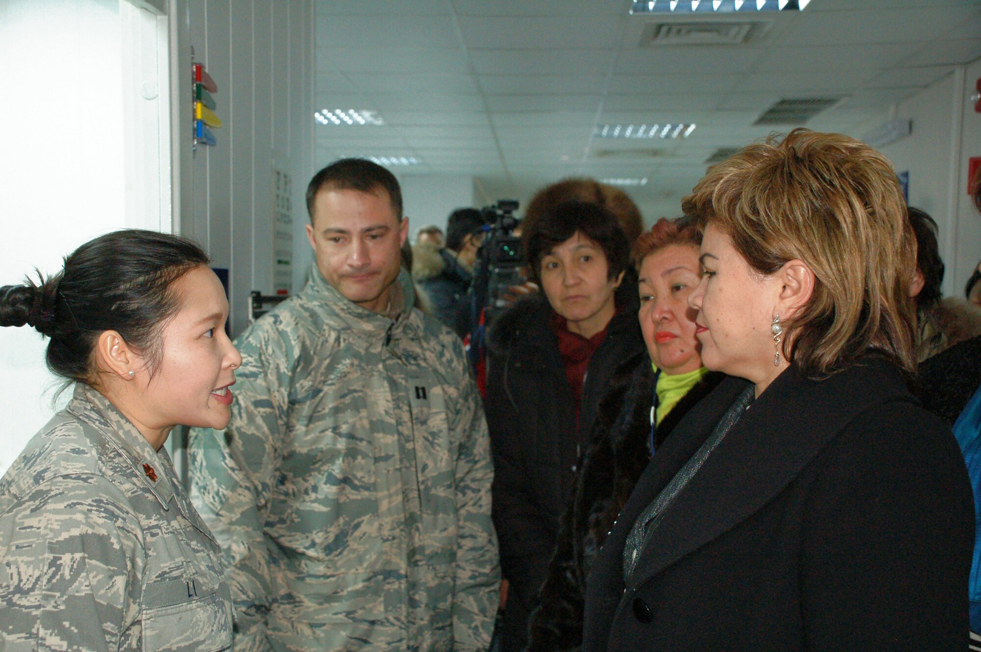 Maj. Wah Sze talks about her job as a doctor here to members for the Kyrgyzstan Congress of Women during a Jan. 8 tour of Manas Air Base, Kyrgyzstan. The group, which consisted of female civic and business leaders from throughout Kyrgyzstan, visited the base to meet with Airmen and to learn more about the mission and the contributions of women who serve there. Major Sze is assigned to the 376th Expeditionary Medical Group. (U.S. Air Force photo/Maj. Damien Pickart) 
