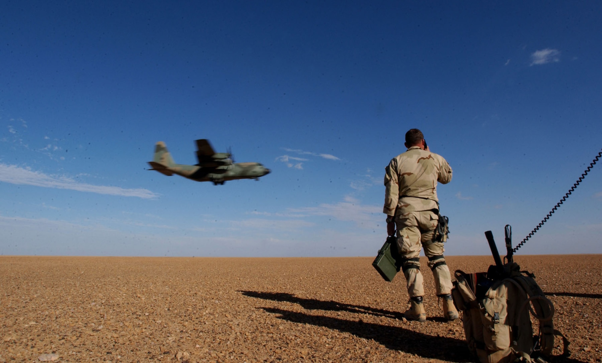 Combat Controller performing air traffic control procedures to establish and evaluate an airfield. This mission was conducted in March 2003 in support of Operation Enduring Freedom in Afghanistan. (U.S. Air Force photo)