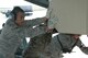 Airman 1st Class Christian Gabriel, 60th Aerial Port Squadron, assists in loading cargo into a C-17 Globemaster III. Travis crewmembers will depart Jan. 10 with equipment to support humanitarian aid operations in Africa. (U.S. Air Force photo/Staff Sgt. Shaun Emery)