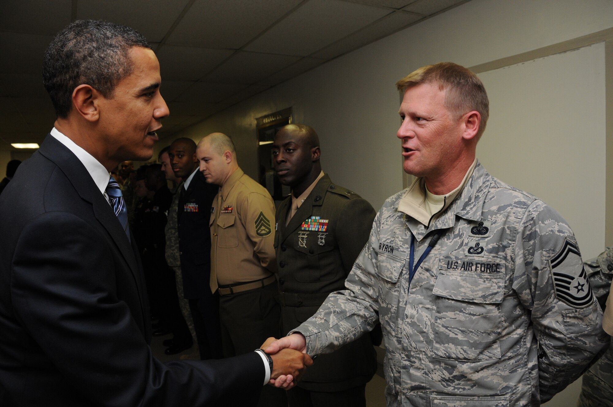 U.S. President-elect Barack Obama shakes hands with Senior Master Sgt. David Byron, an Air Force reservist and Armed Forces Inaugural Committee member, in Washington, D.C., Jan. 8, 2009. AFIC carries on a tradition, which dates back more than 200 years, of honoring the new commander in chief and recognizing civilian control of the military. AFIC is a joint-service organization responsible for providing military ceremonial support to the 56th Presidential Inauguration, which will take place on Jan. 20, 2009. (U.S. Coast Guard photo\Petty Officer 1st Class Kyle Niemi)
