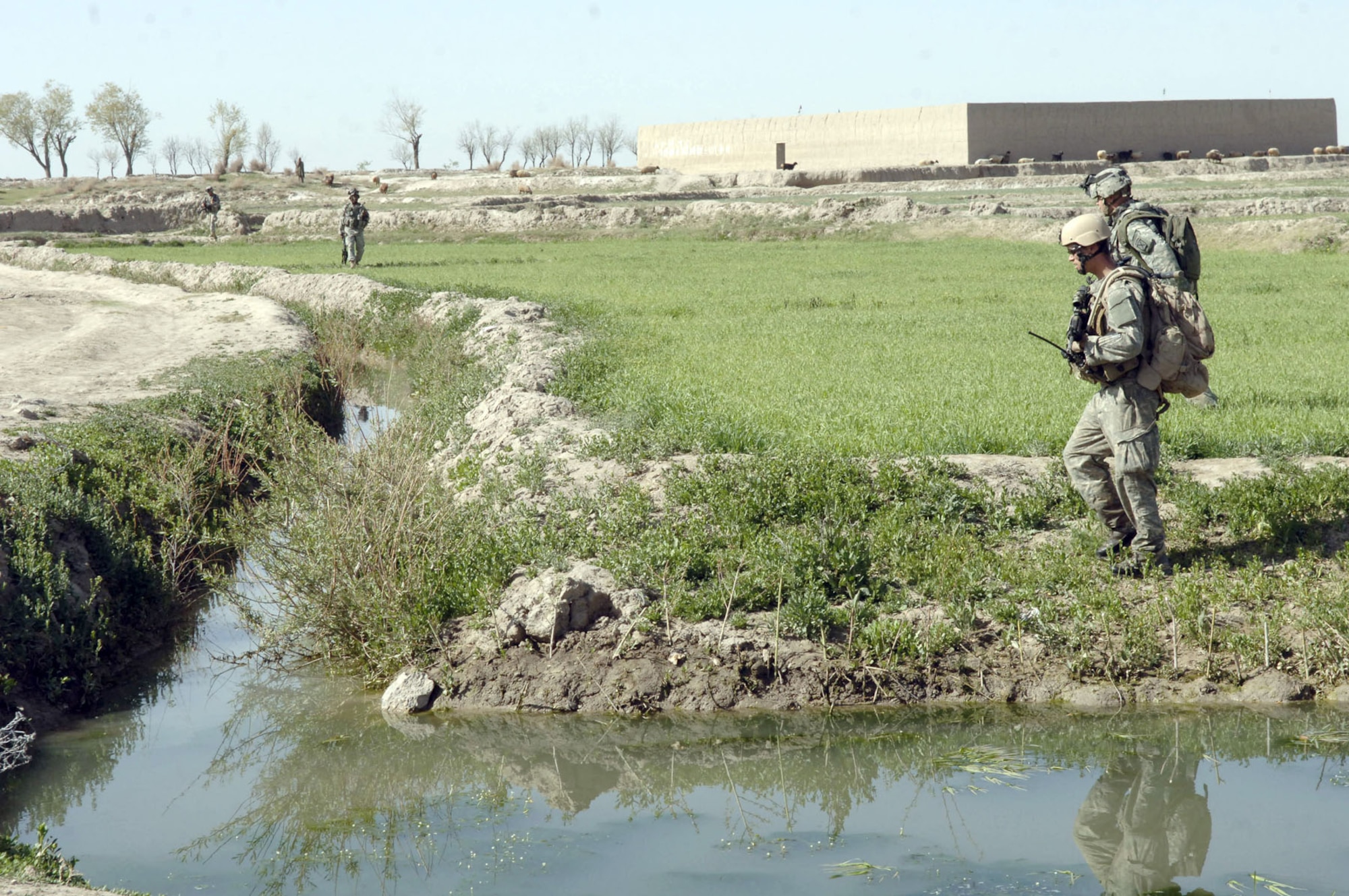 Air Force JTAC (foreground) on foot patrol with soldiers from the 10th Mountain Division in Afghanistan. (U.S. Air Force photo)